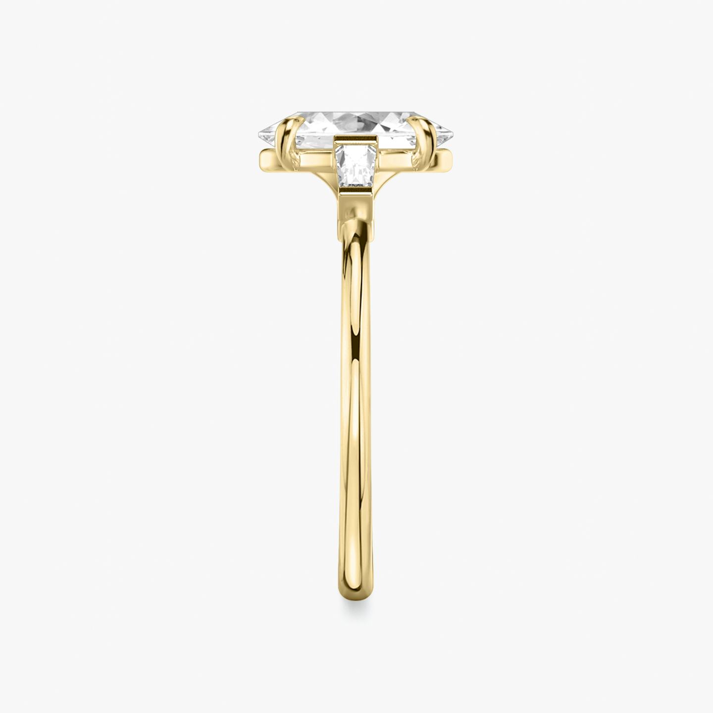 The Three Stone | Oval | 18k | 18k Yellow Gold | Band: Plain | Side stone carat: 1/10 | Side stone shape: Tapered Baguette | Diamond orientation: vertical | Carat weight: See full inventory