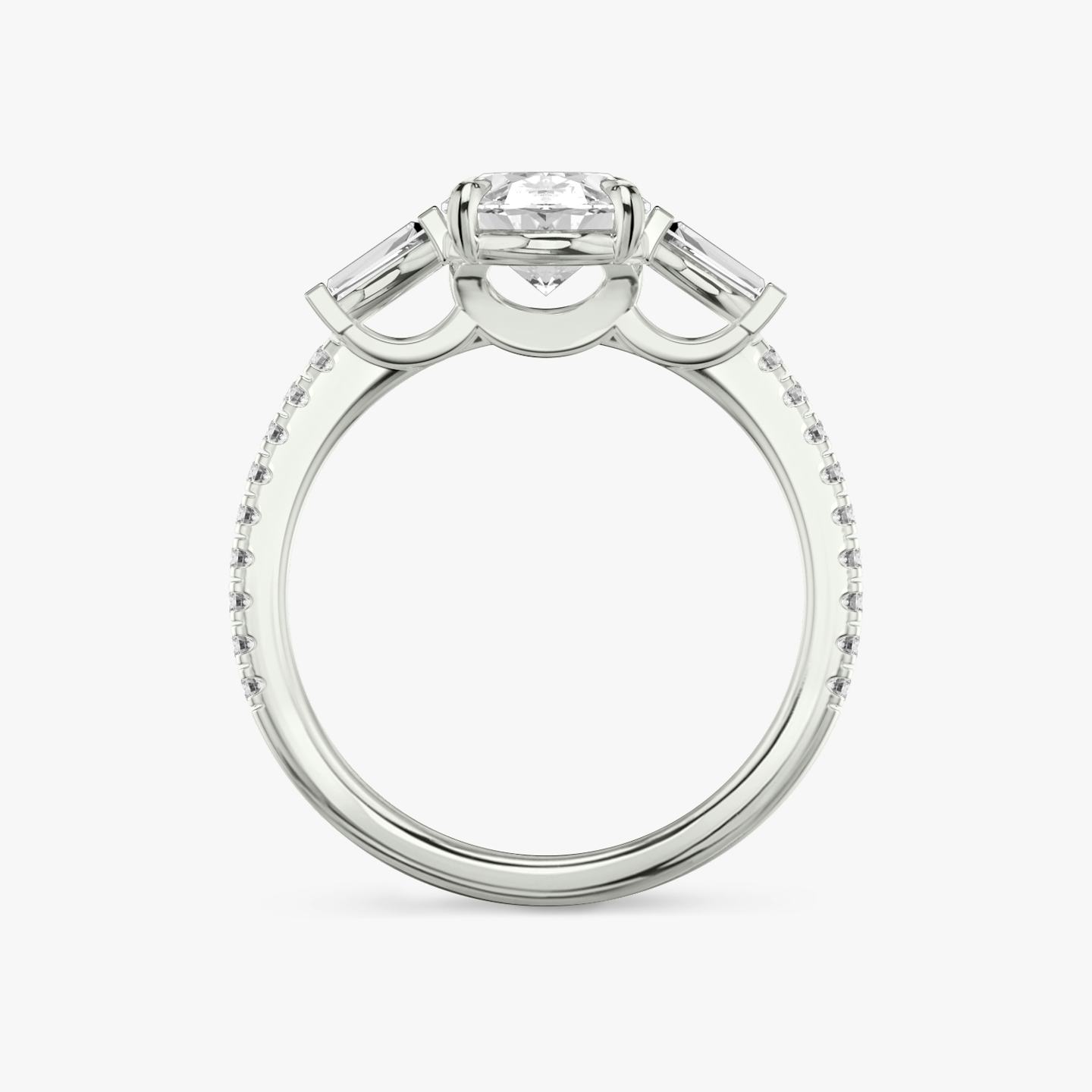 The Three Stone | Oval | Platinum | Band: Pavé | Side stone carat: 1/10 | Side stone shape: Tapered Baguette | Diamond orientation: vertical | Carat weight: See full inventory