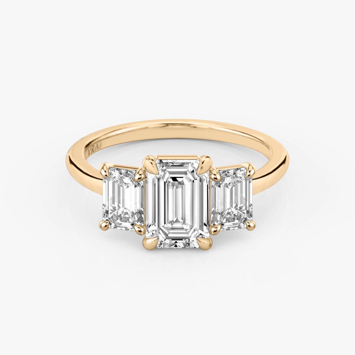 The Three Stone | Emerald | 14k | 14k Rose Gold | Band: Plain | Side stone carat: 1/2 | Side stone shape: Emerald | Diamond orientation: vertical | Carat weight: See full inventory