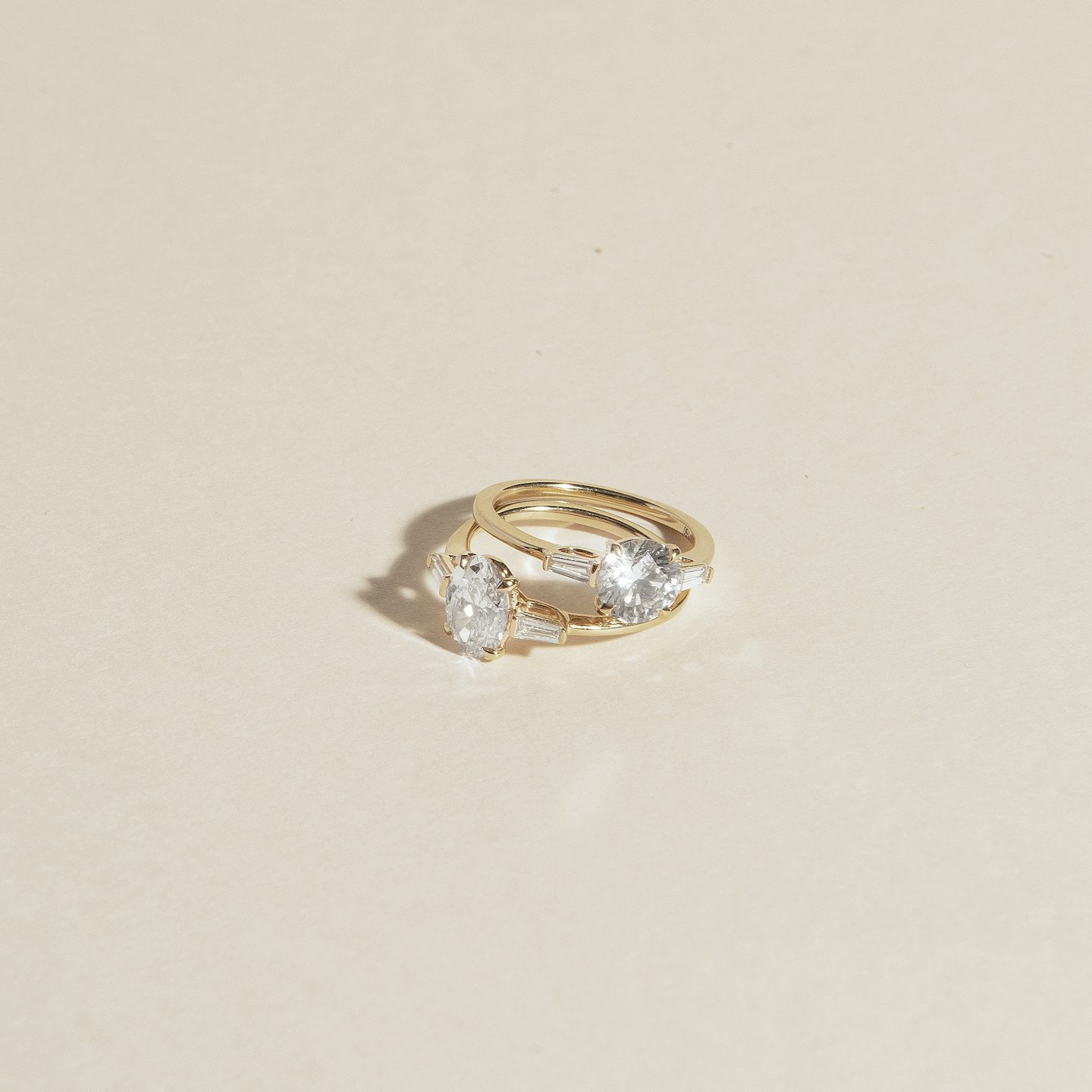 The Three Stone | Round Brilliant | Platinum | Band: Plain | Carat weight: 1½ | Side stone carat: 1/10 | Side stone shape: Tapered Baguette | Diamond orientation: vertical