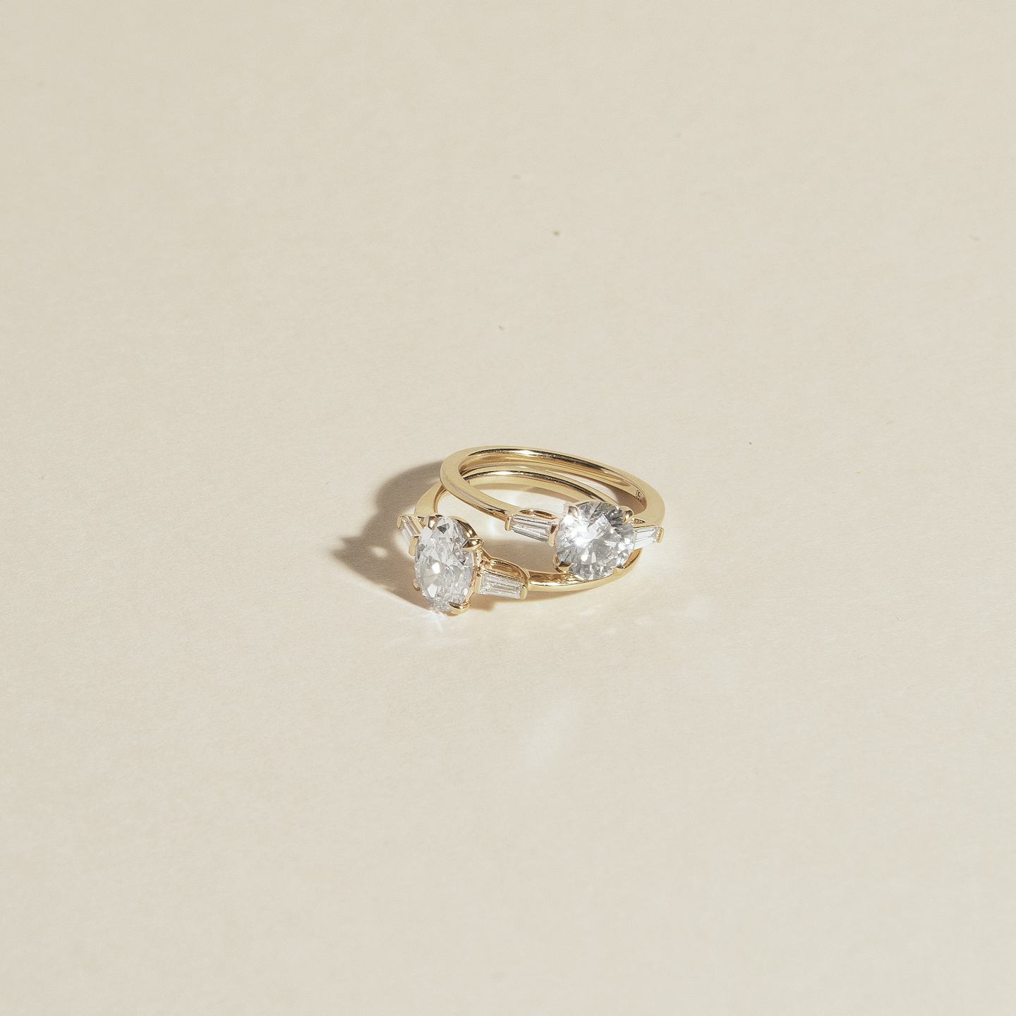 The Three Stone | Round Brilliant | Platinum | Band: Plain | Carat weight: 1 | Side stone carat: 1/10 | Side stone shape: Tapered Baguette | Diamond orientation: vertical