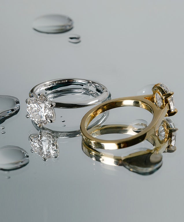 two diamond engagement  rings with lab-grown diamonds, one in yellow gold and one in platinum