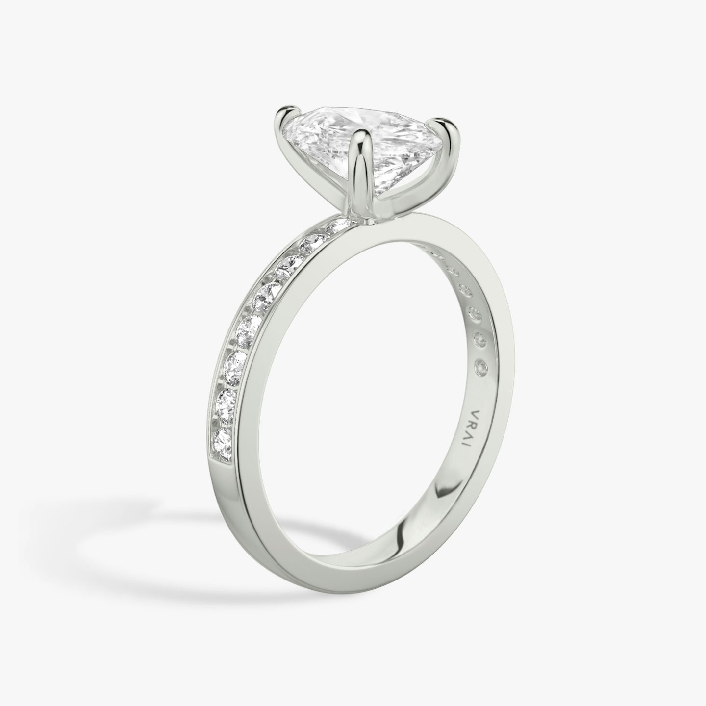The Devotion | Pear | Platinum | Band: Pavé | Band stone shape: Round Brilliant | Band: Large | Diamond orientation: vertical | Carat weight: See full inventory