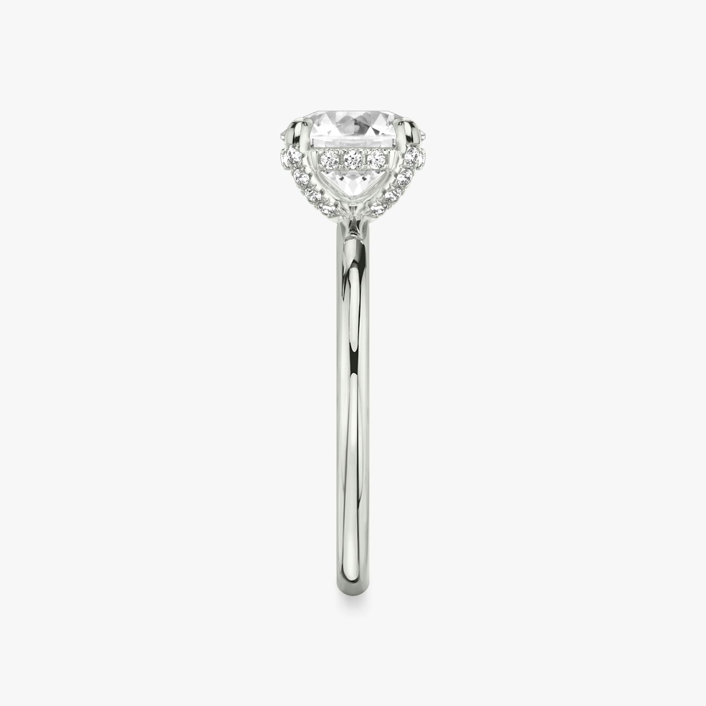 The Classic Hidden Halo | Round Brilliant | Platinum | Band: Plain | Carat weight: See full inventory | Prong style: Pavé | Diamond orientation: vertical