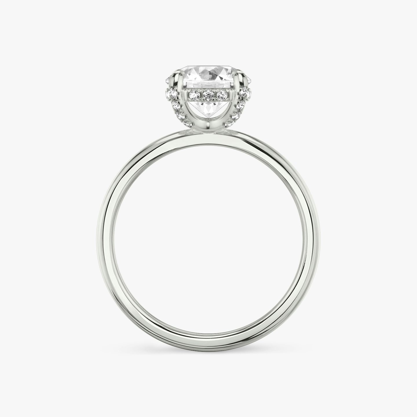 The Classic Hidden Halo | Round Brilliant | Platinum | Band: Plain | Carat weight: See full inventory | Prong style: Pavé | Diamond orientation: vertical