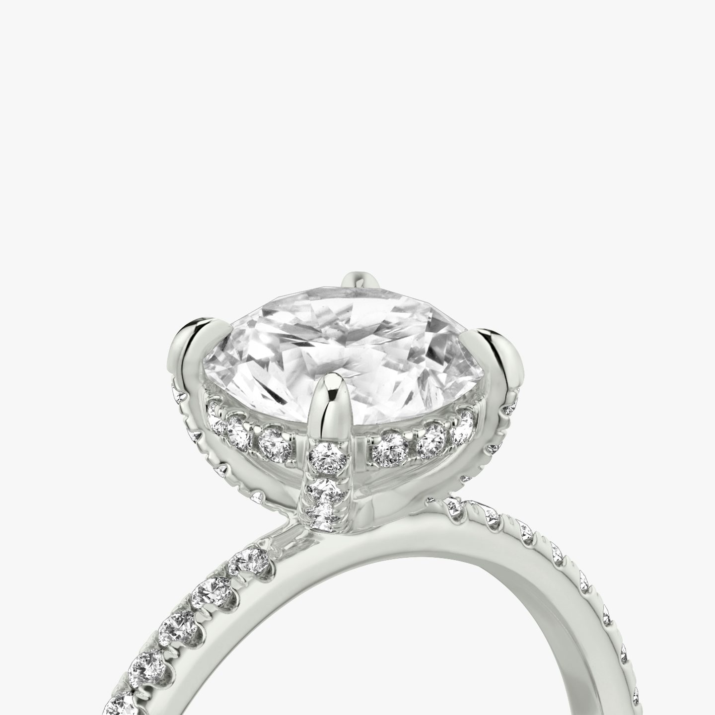 The Classic Hidden Halo | Round Brilliant | Platinum | Band: Pavé | Carat weight: See full inventory | Prong style: Pavé | Diamond orientation: vertical