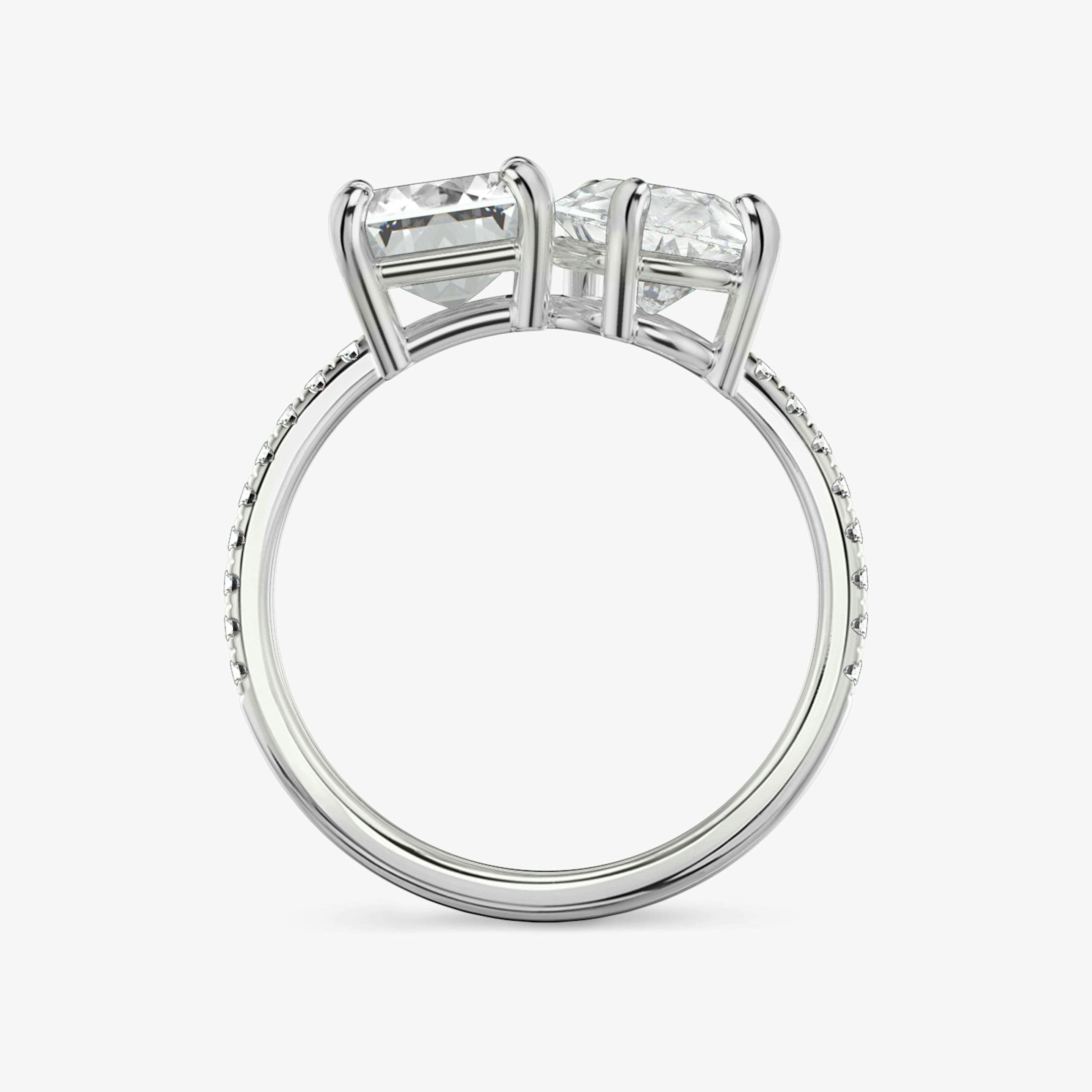 The Toi et Moi | Emerald and Pear | Platinum | Band: Pavé | Diamond orientation: vertical | Carat weight: See full inventory
