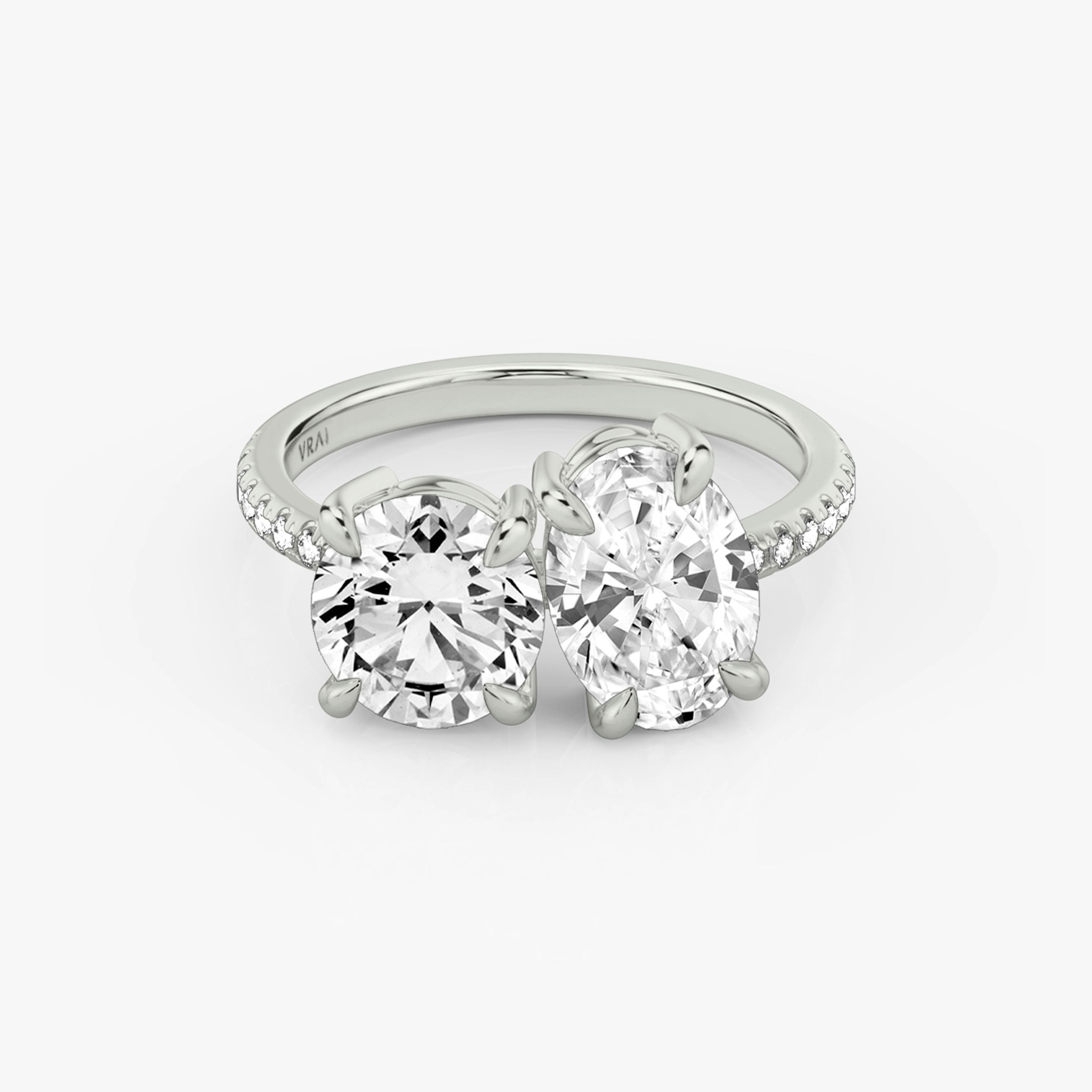 The Toi et Moi | Round Brilliant and Oval | Platinum | Band: Pavé | Diamond orientation: vertical | Carat weight: See full inventory