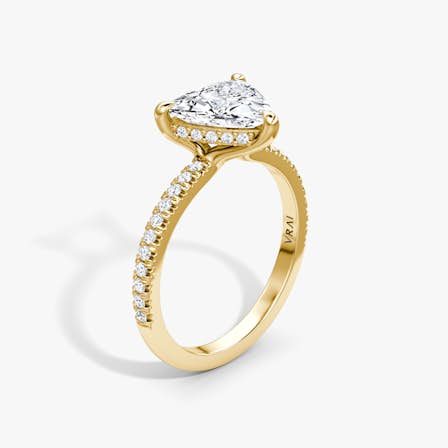 Yellow gold floating solitaire engagement ring with Trillion cut diamond