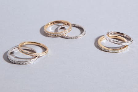 three sets of promise rings in gold and silver