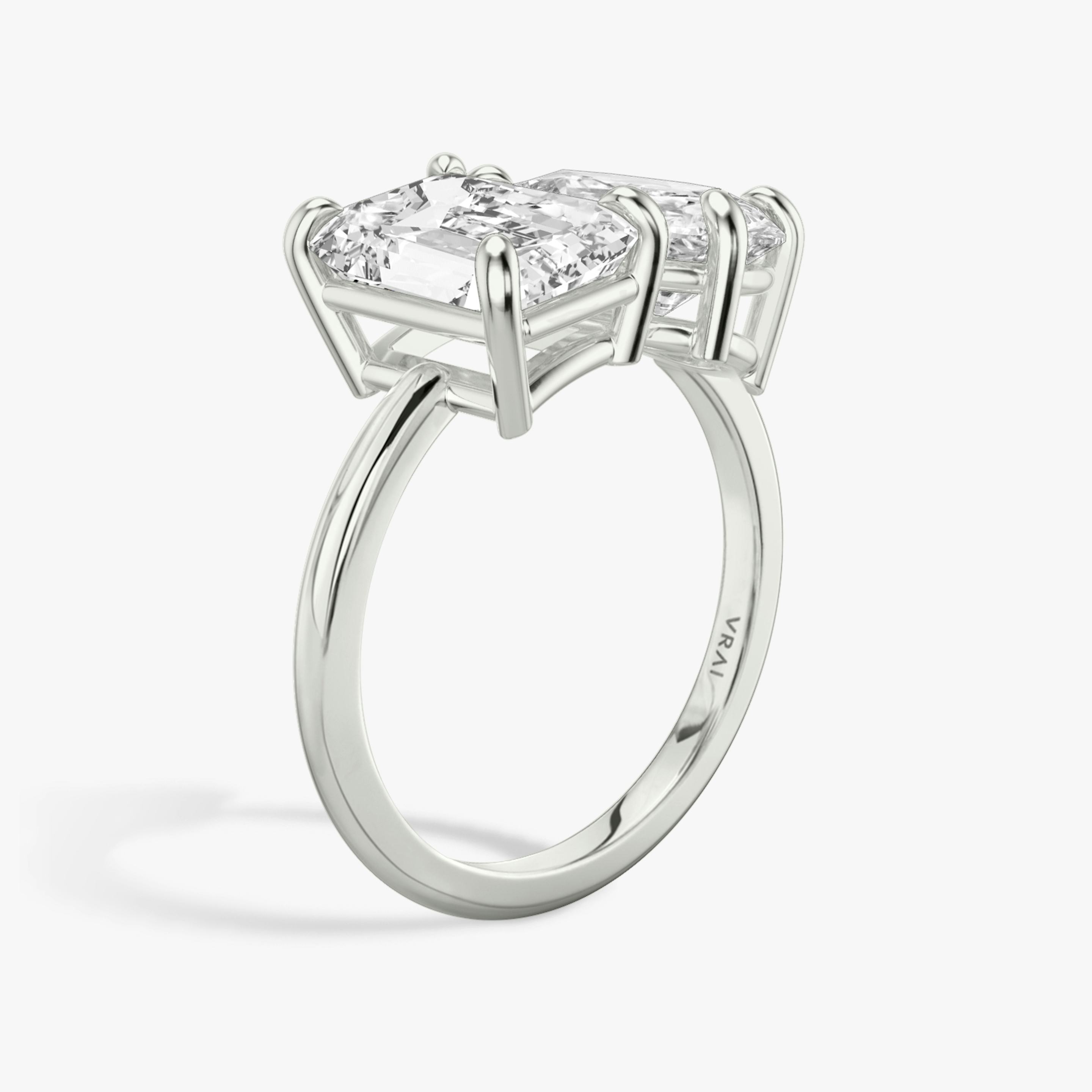 The Toi et Moi | Emerald and Pear | Platinum | Band: Plain | Diamond orientation: vertical | Carat weight: See full inventory