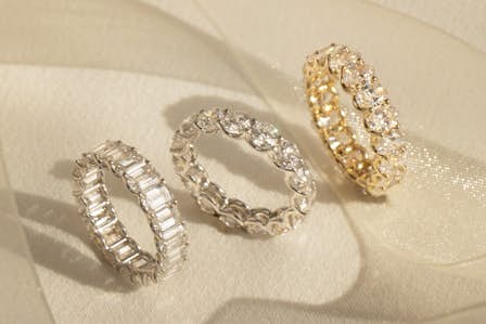 three uniquely styled wedding rings in yellow and white gold and platinum