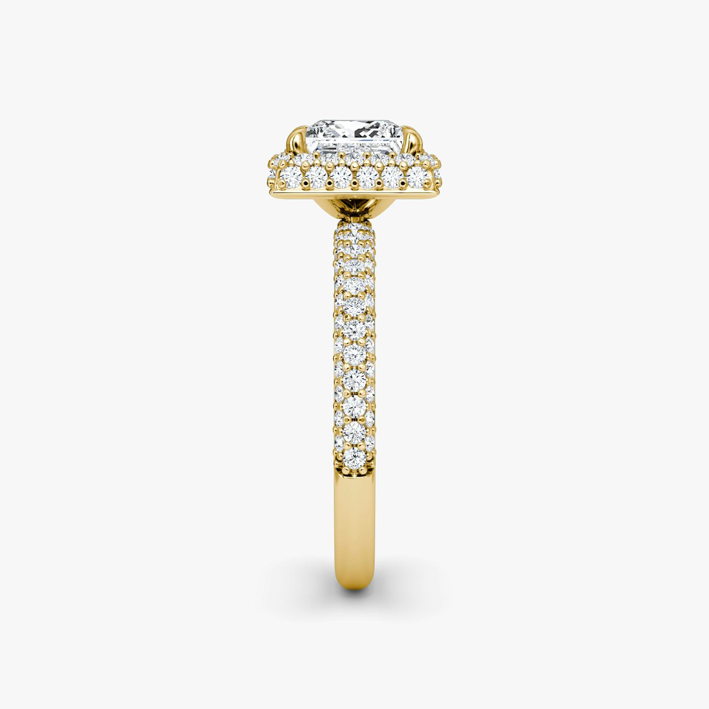 side view of three-row dome halo engagement ring princess cut in pave yellow gold
