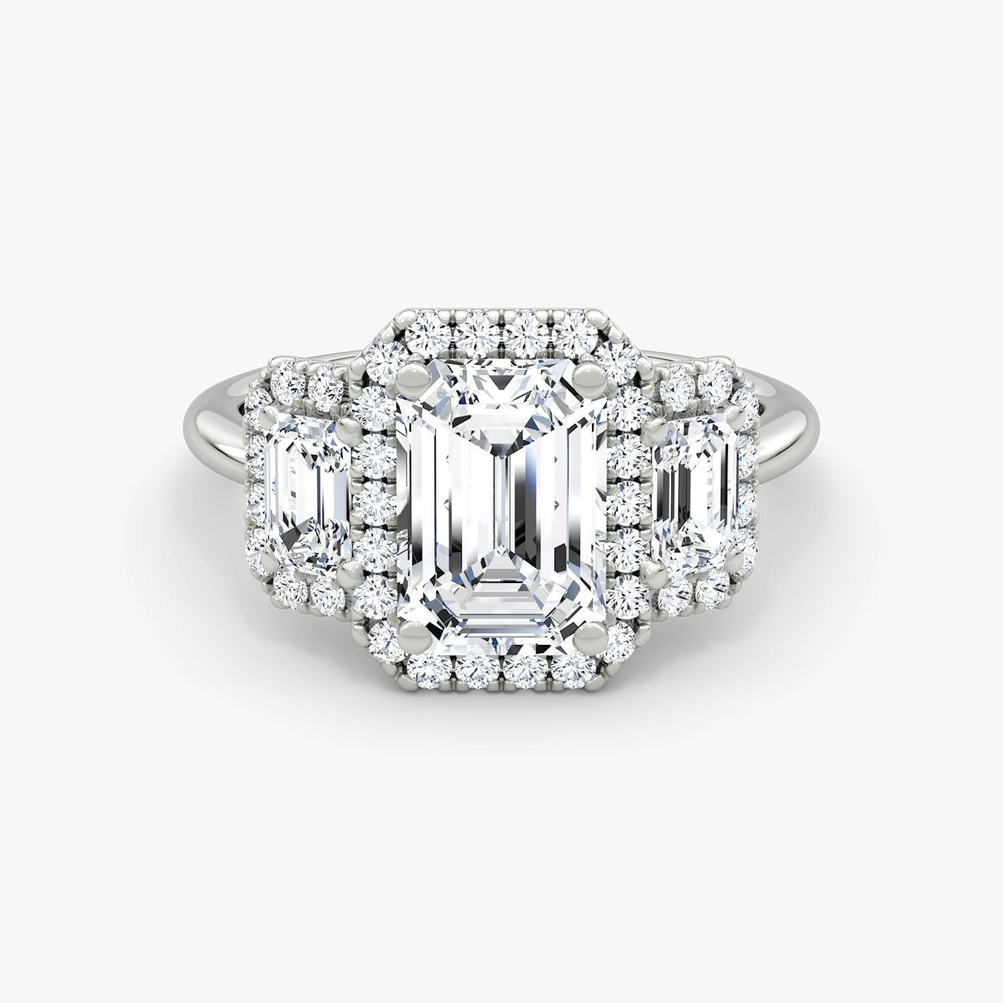 The Three Stone Halo | Emerald | Platinum | Side stone carat: 1/4 | Diamond orientation: vertical | Carat weight: See full inventory