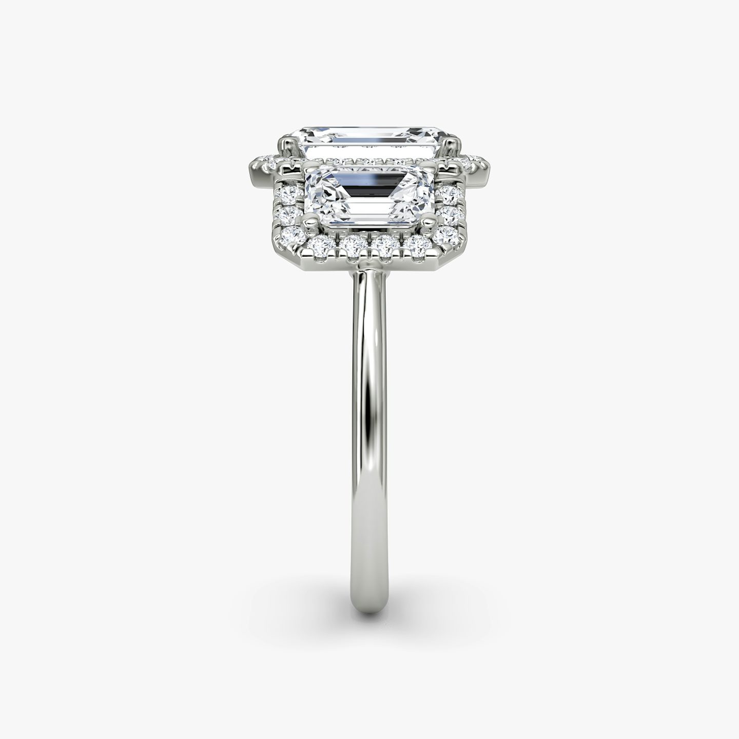 The Three Stone Halo | Emerald | 18k | 18k White Gold | Band: Plain | Side stone carat: 1/2 | Diamond orientation: vertical | Carat weight: See full inventory