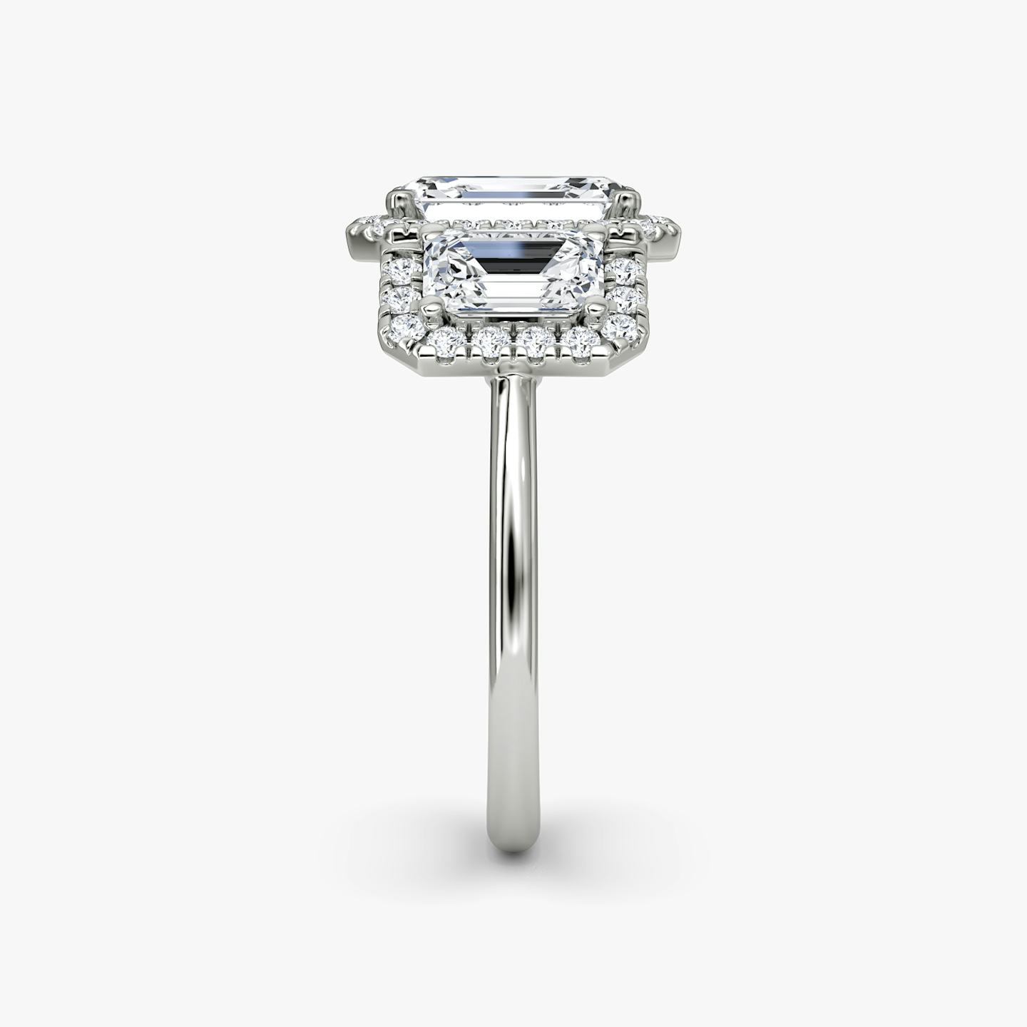 The Three Stone Halo | Emerald | Platinum | Side stone carat: 1/2 | Diamond orientation: vertical | Carat weight: See full inventory
