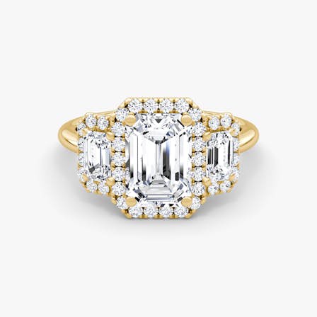 halo three stone emerald ring