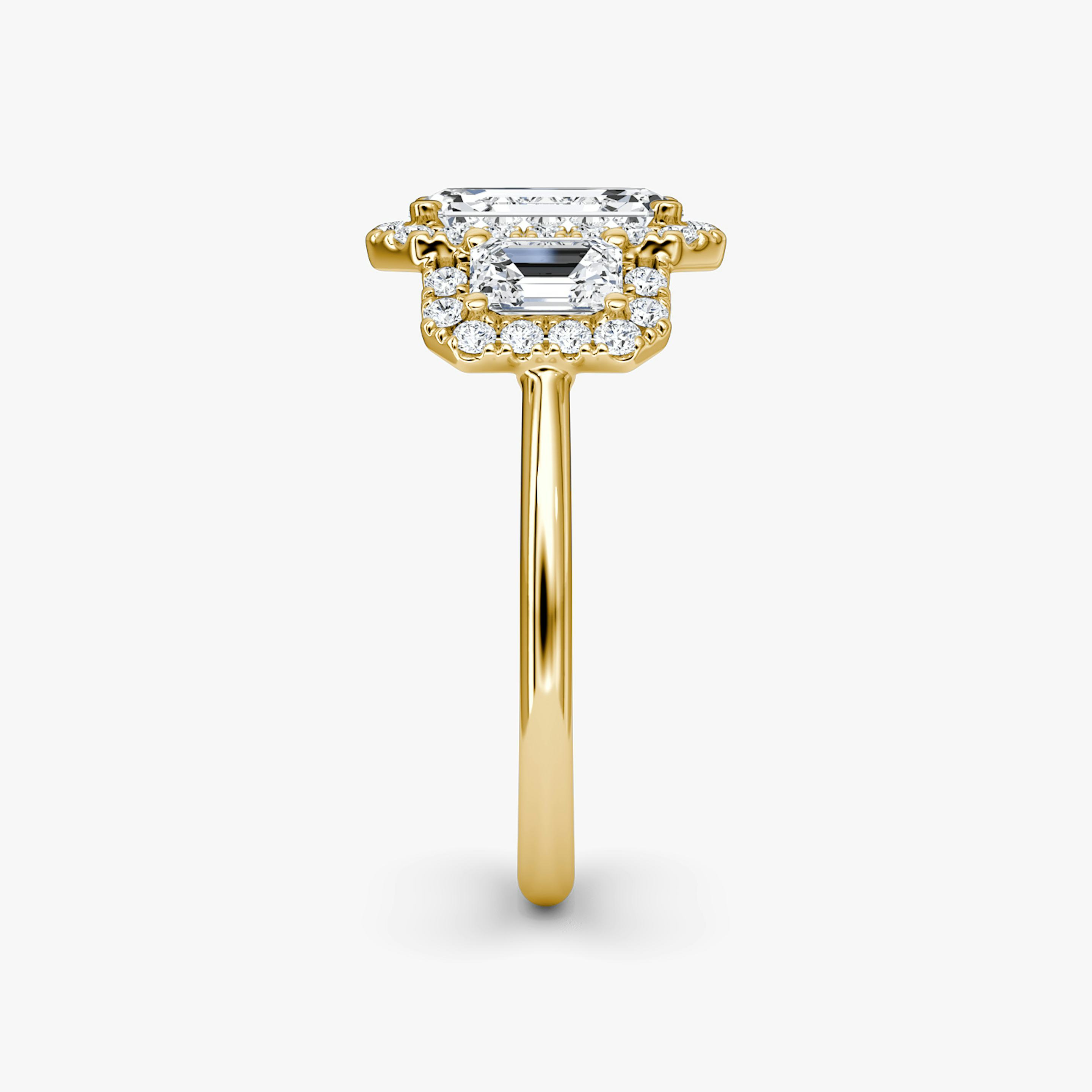 The Three Stone Halo | Emerald | 18k | 18k Yellow Gold | Side stone carat: 1/4 | Diamond orientation: vertical | Carat weight: See full inventory