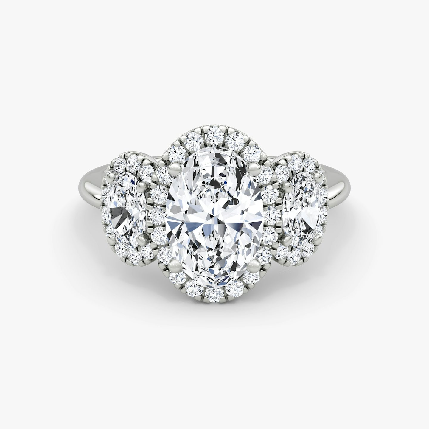 The Three Stone Halo | Oval | 18k | 18k White Gold | Side stone carat: 1/4 | Diamond orientation: vertical | Carat weight: See full inventory