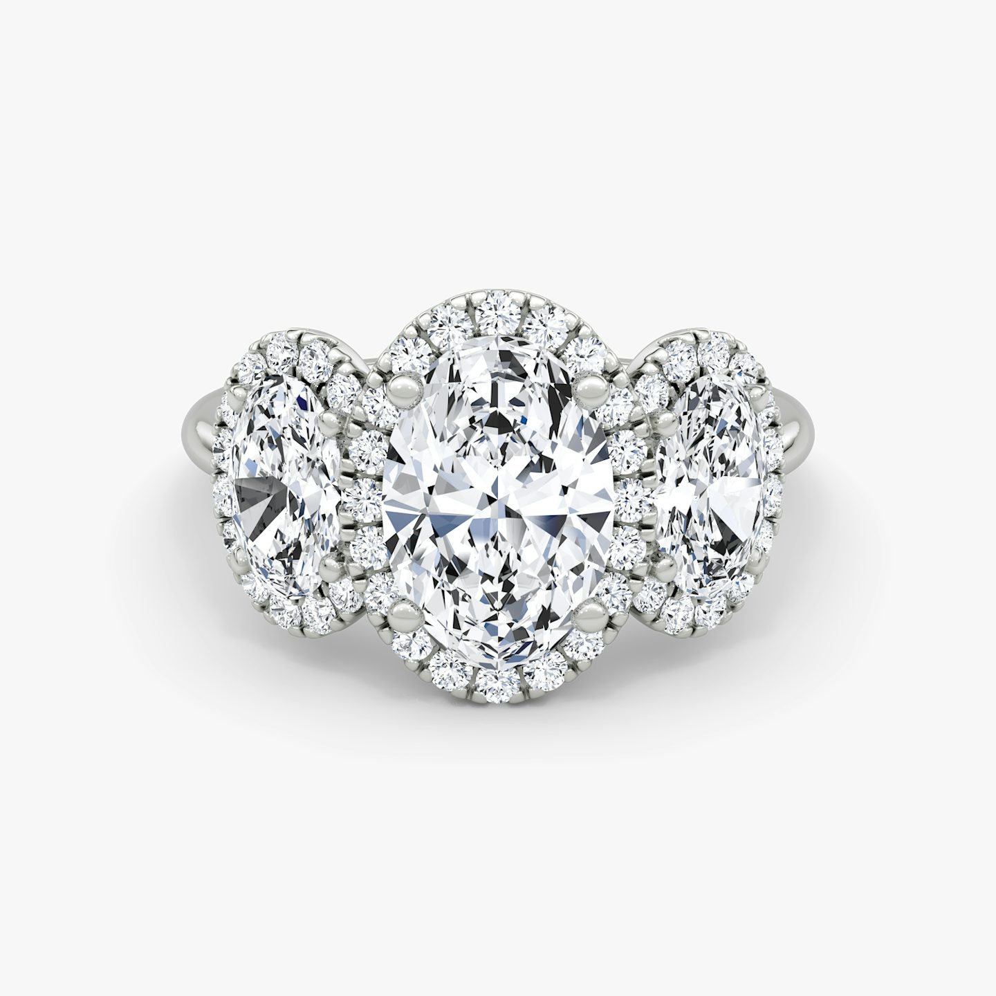 The Three Stone Halo | Oval | 18k | 18k White Gold | Band: Plain | Side stone carat: 1/2 | Diamond orientation: vertical | Carat weight: See full inventory