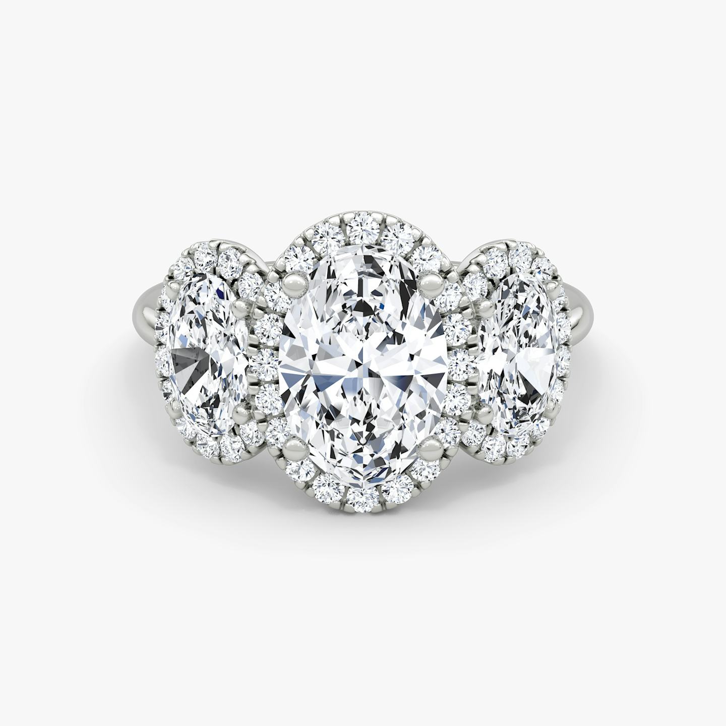The Three Stone Halo | Oval | Platinum | Side stone carat: 1/2 | Diamond orientation: vertical | Carat weight: See full inventory