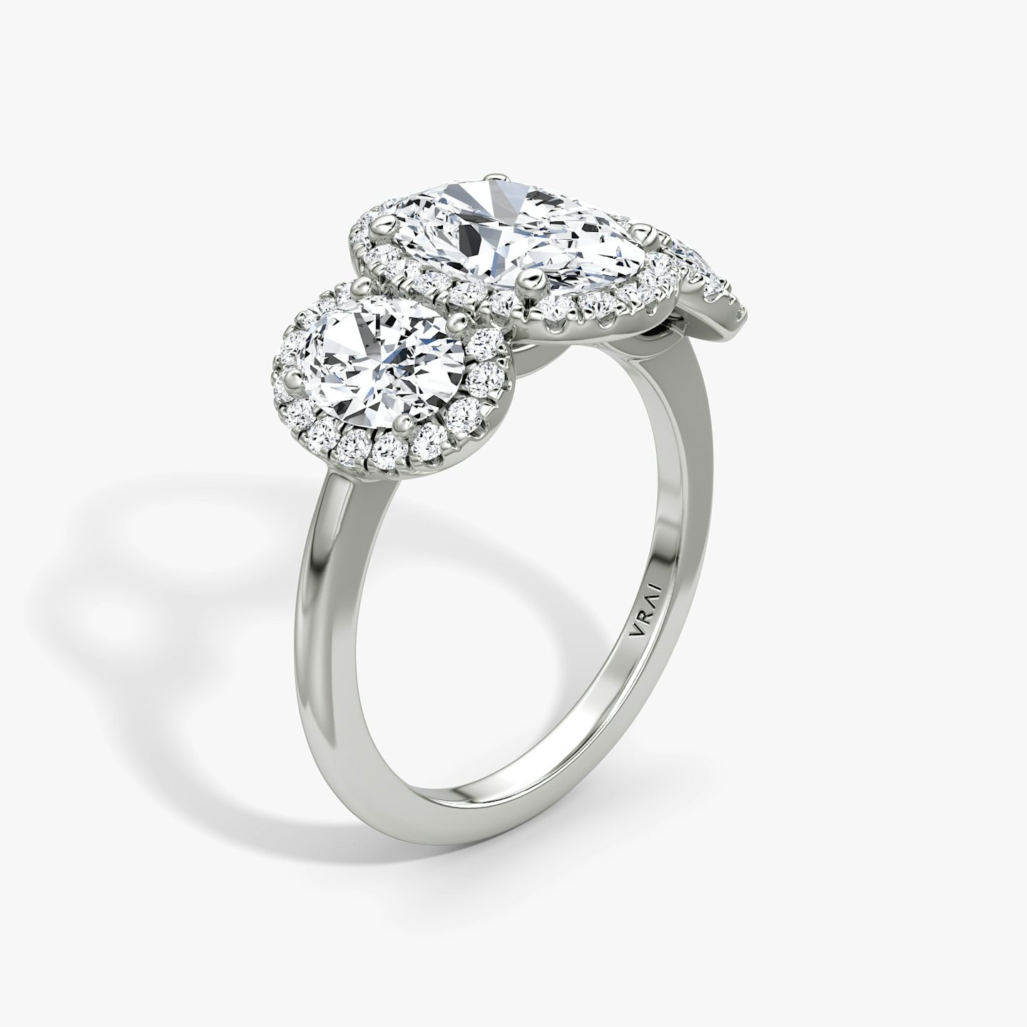 The Three Stone Halo | Oval | 18k | 18k White Gold | Band: Plain | Side stone carat: 1/2 | Diamond orientation: vertical | Carat weight: See full inventory