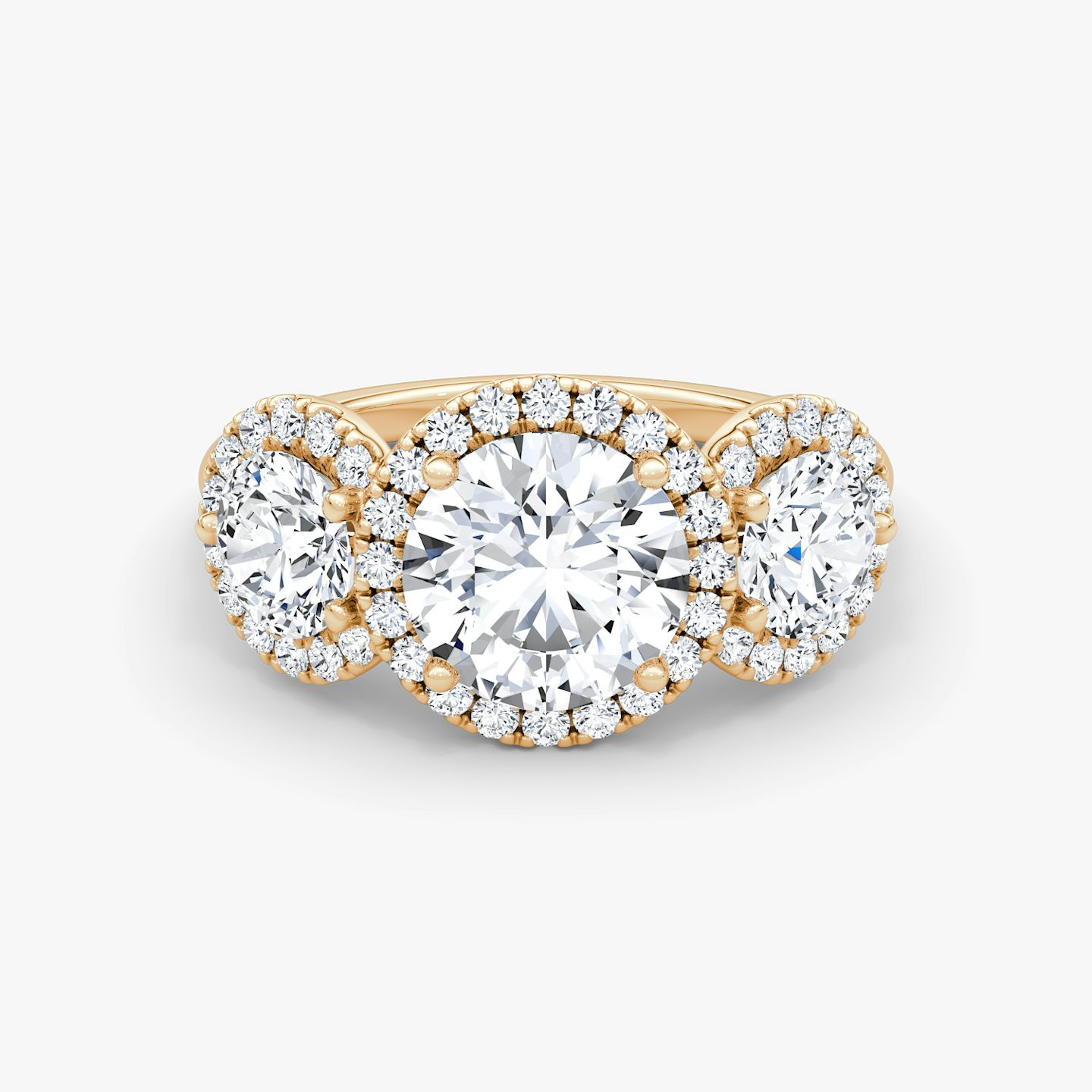 The Three Stone Halo | Round Brilliant | 14k | 14k Rose Gold | Carat weight: See full inventory | Side stone carat: 1/2 | Diamond orientation: vertical