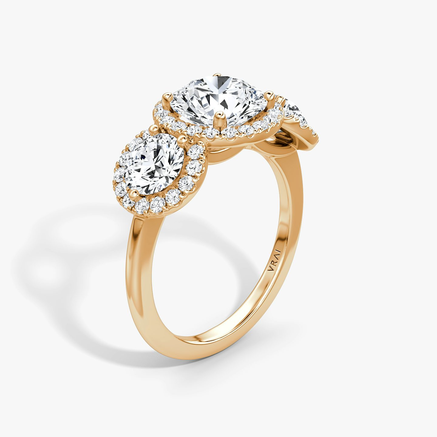 The Three Stone Halo | Round Brilliant | 14k | 14k Rose Gold | Band: Plain | Carat weight: See full inventory | Side stone carat: 1/2 | Diamond orientation: vertical