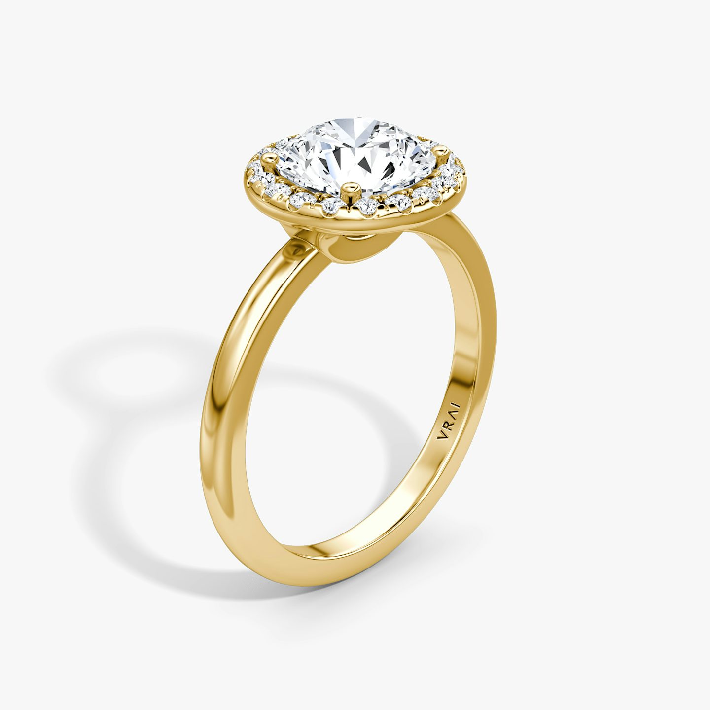 The Halo | Round Brilliant | 18k | 18k Yellow Gold | Halo: Original | Band: Plain | Carat weight: See full inventory | Diamond orientation: vertical