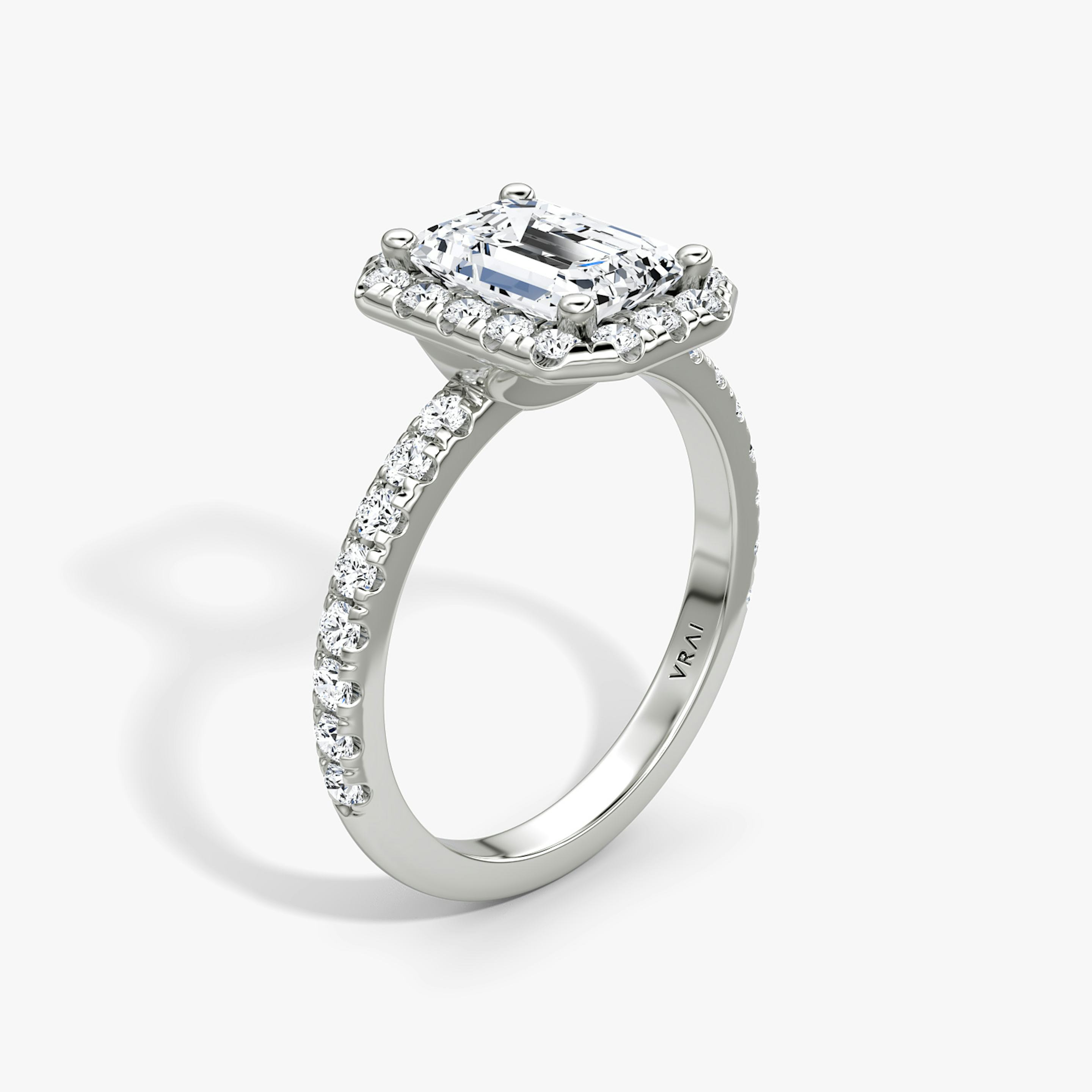The Halo | Emerald | Platinum | Halo: Large | Band: Pavé | Diamond orientation: vertical | Carat weight: See full inventory