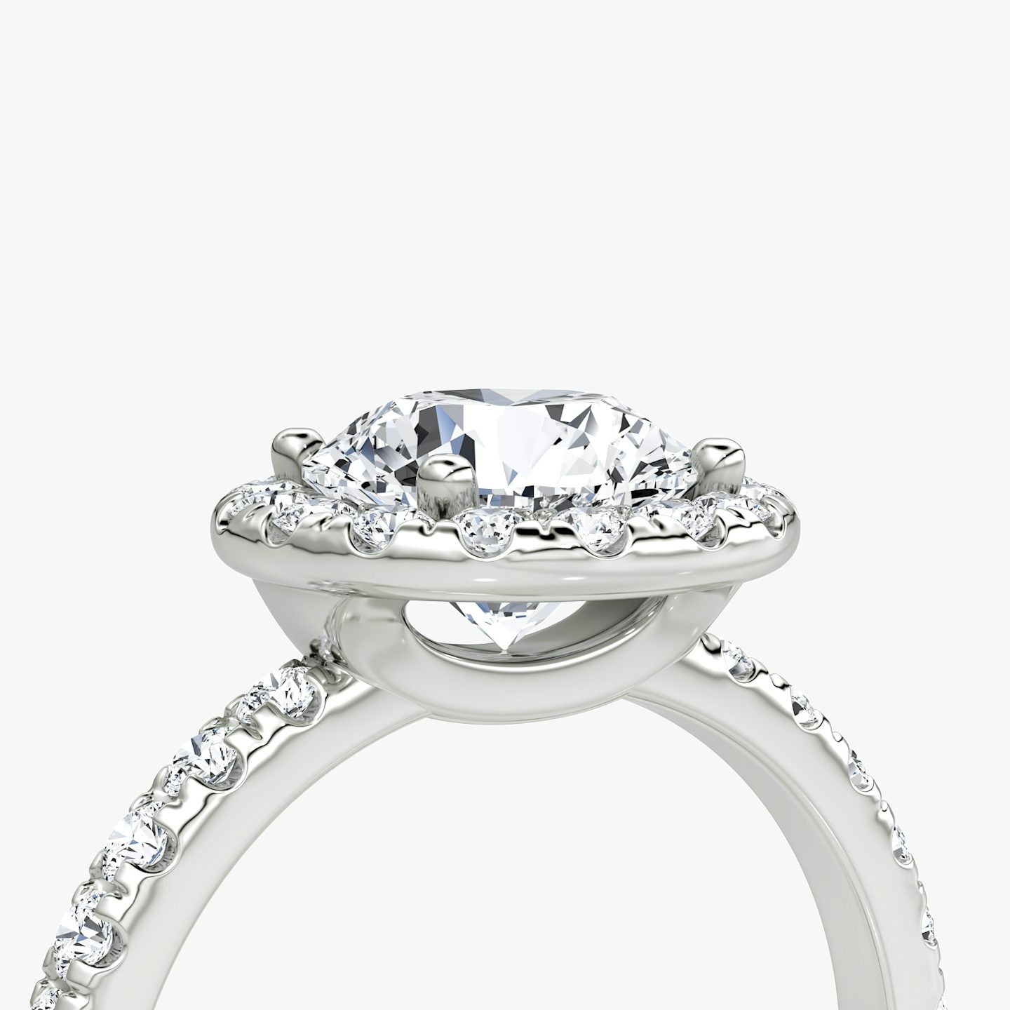 The Halo | Round Brilliant | Platinum | Halo: Large | Band: Pavé | Carat weight: See full inventory | Diamond orientation: vertical