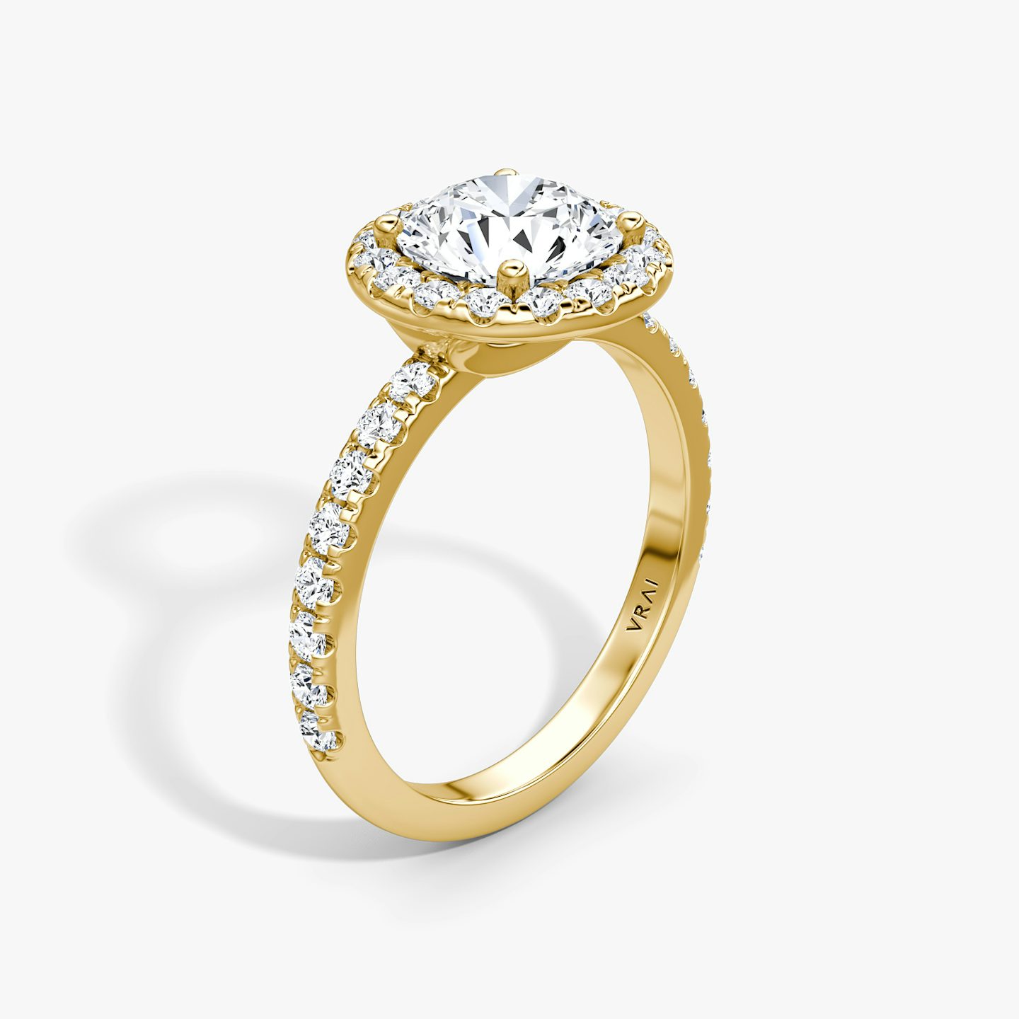 The Halo | Round Brilliant | 18k | 18k Yellow Gold | Halo: Large | Band: Pavé | Carat weight: See full inventory | Diamond orientation: vertical