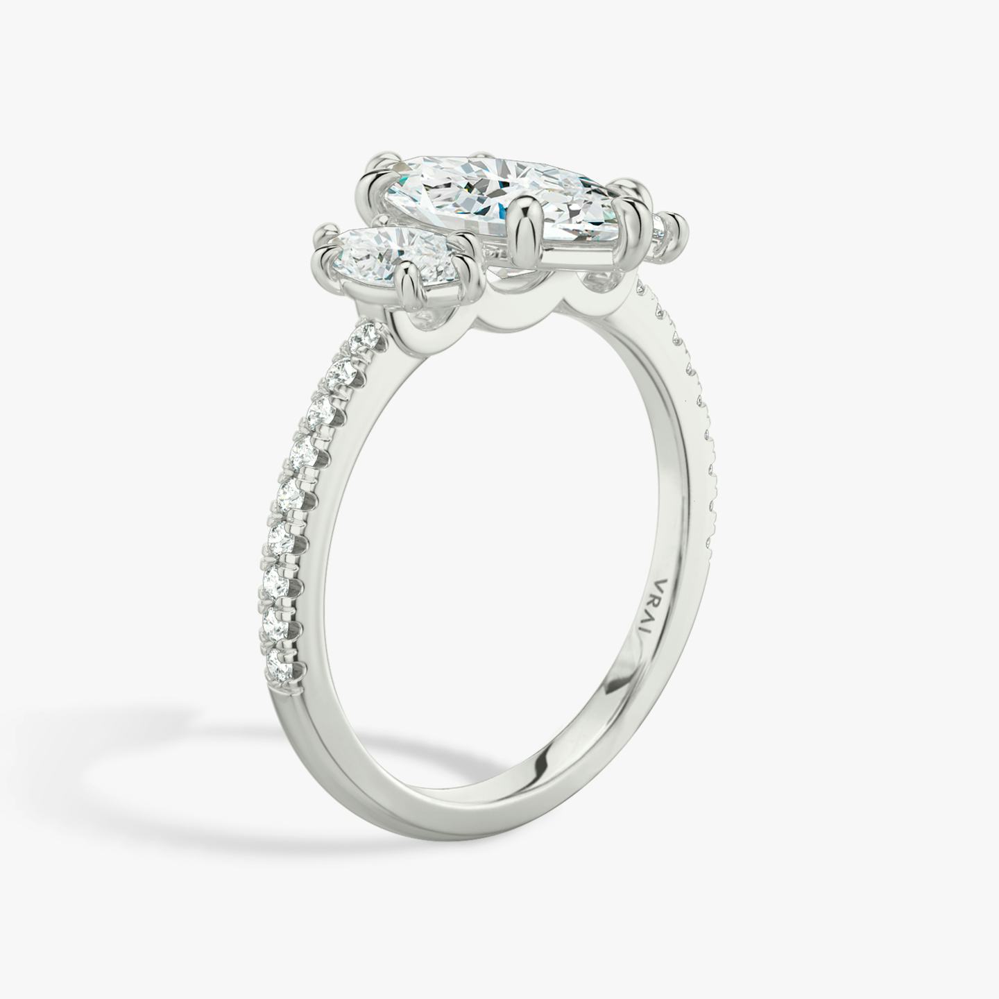 The Three Stone | Pavé Marquise | Platinum | Band: Pavé | Side stone carat: 1/4 | Side stone shape: Pavé Marquise | Diamond orientation: vertical | Carat weight: See full inventory