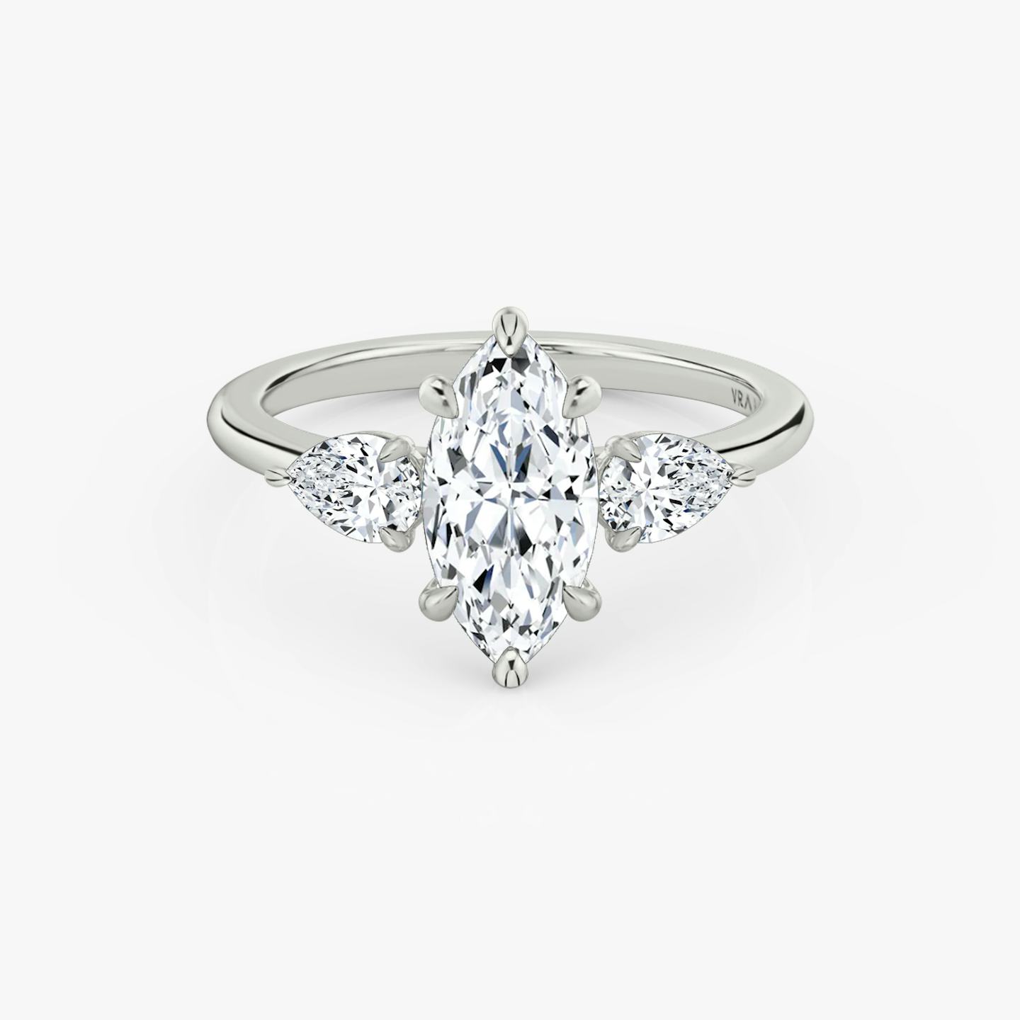 The Three Stone | Pavé Marquise | Platinum | Band: Plain | Side stone carat: 1/4 | Side stone shape: Pear | Diamond orientation: vertical | Carat weight: See full inventory