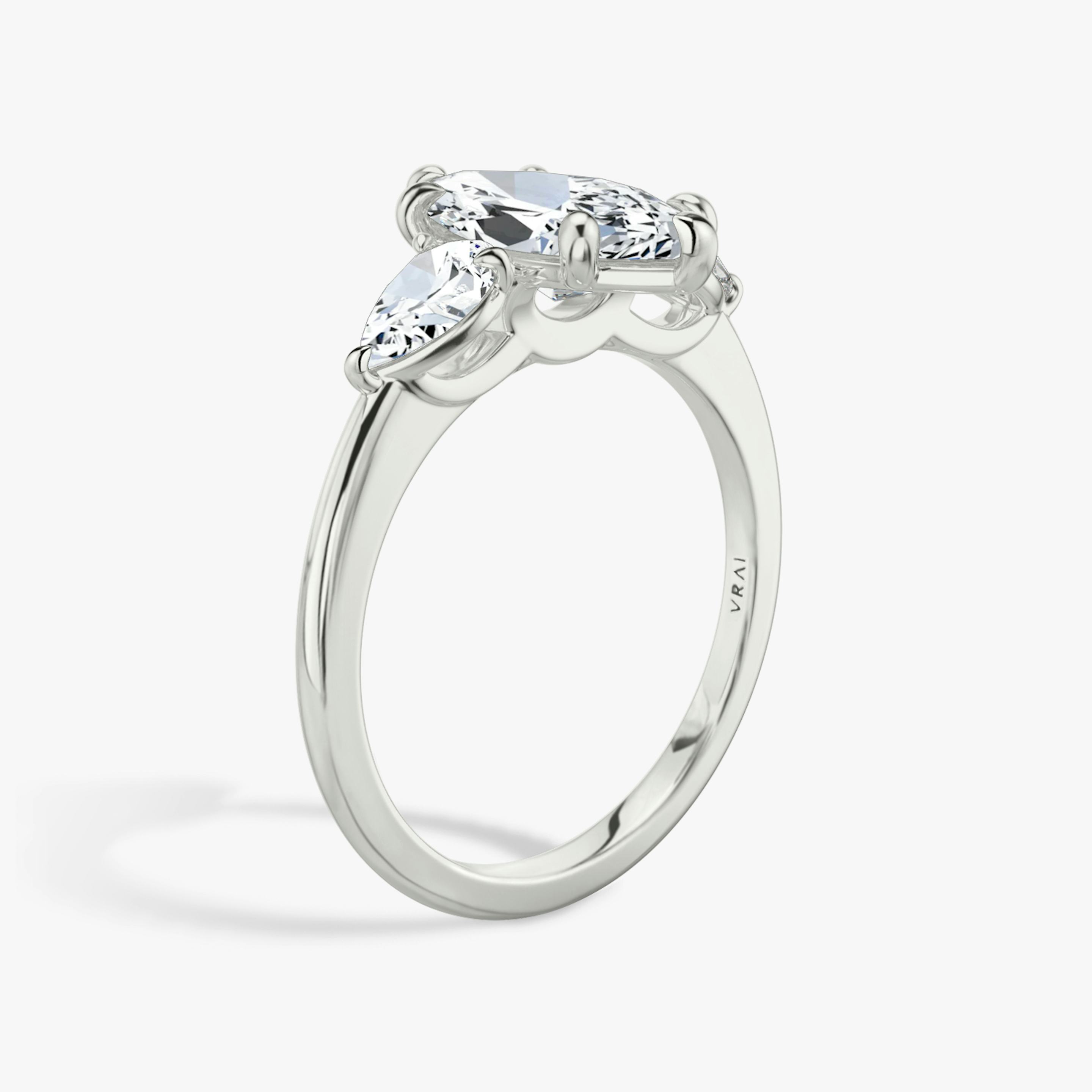 The Three Stone | Pavé Marquise | Platinum | Band: Plain | Side stone carat: 1/4 | Side stone shape: Pear | Diamond orientation: vertical | Carat weight: See full inventory