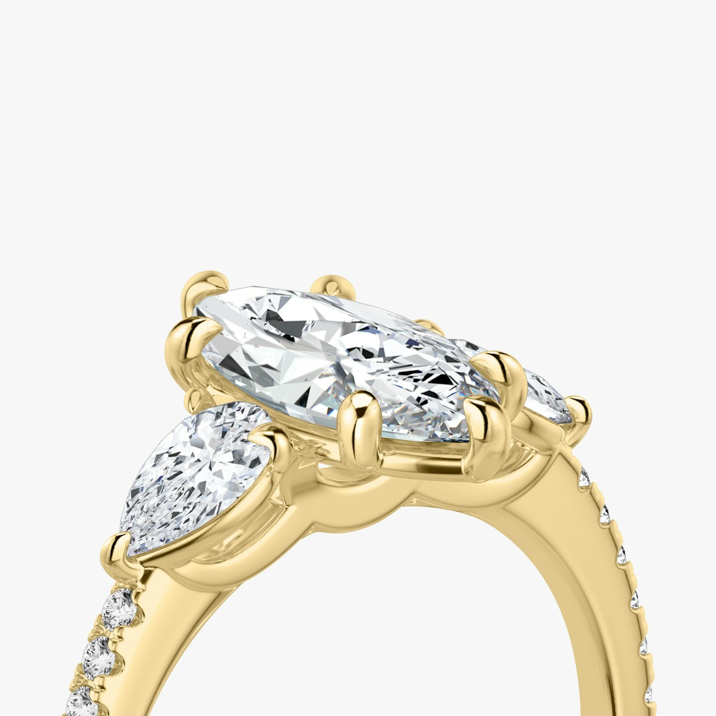 The Three Stone | Pavé Marquise | 18k | 18k Yellow Gold | Band: Pavé | Side stone carat: 1/4 | Side stone shape: Pear | Diamond orientation: vertical | Carat weight: See full inventory