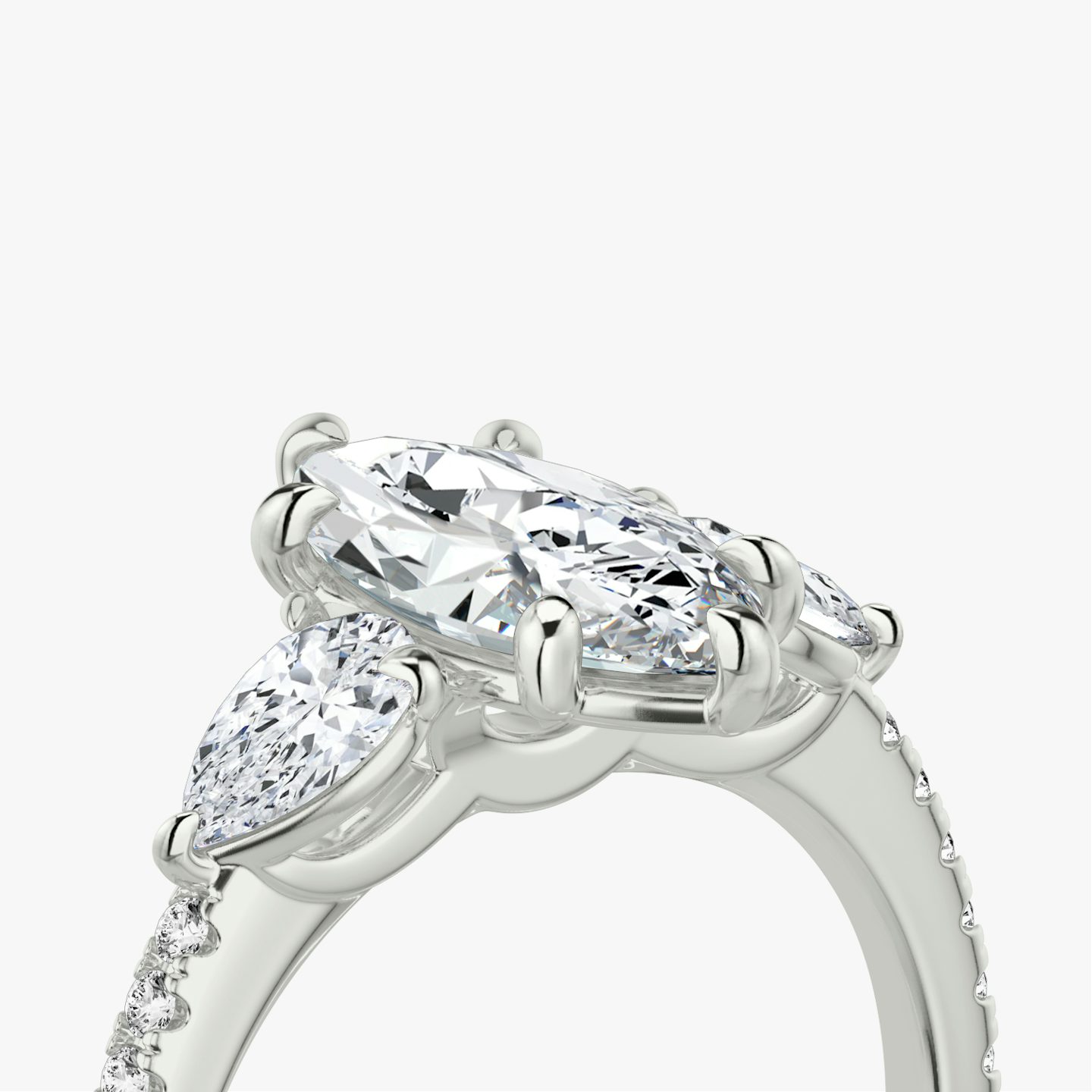 The Three Stone | Pavé Marquise | 18k | 18k White Gold | Band: Pavé | Side stone carat: 1/4 | Side stone shape: Pear | Diamond orientation: vertical | Carat weight: See full inventory