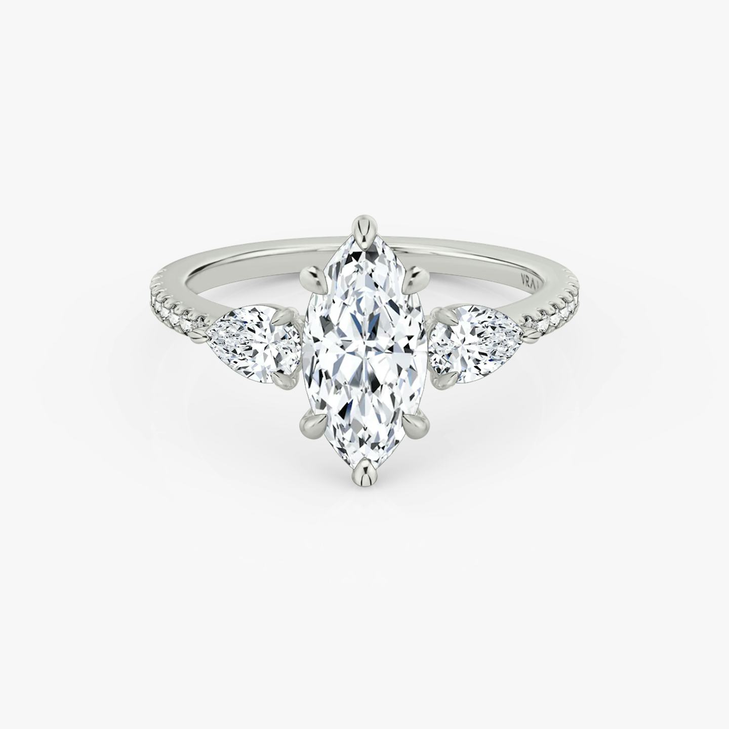 The Three Stone | Pavé Marquise | Platinum | Band: Pavé | Side stone carat: 1/4 | Side stone shape: Pear | Diamond orientation: vertical | Carat weight: See full inventory