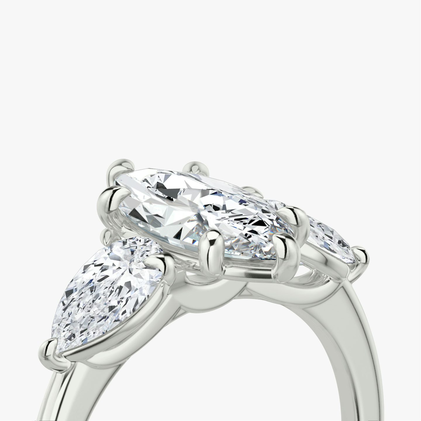 The Three Stone | Pavé Marquise | 18k | 18k White Gold | Band: Plain | Side stone carat: 1/2 | Side stone shape: Pear | Diamond orientation: vertical | Carat weight: See full inventory