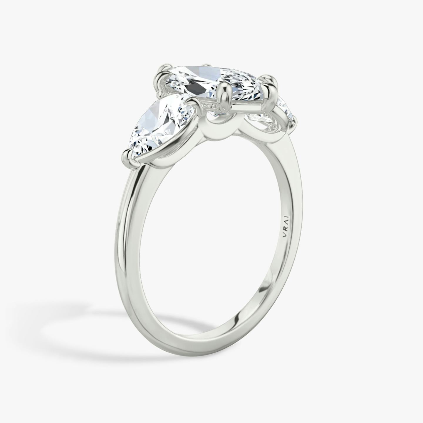The Three Stone | Pavé Marquise | Platinum | Band: Plain | Side stone carat: 1/2 | Side stone shape: Pear | Diamond orientation: vertical | Carat weight: See full inventory