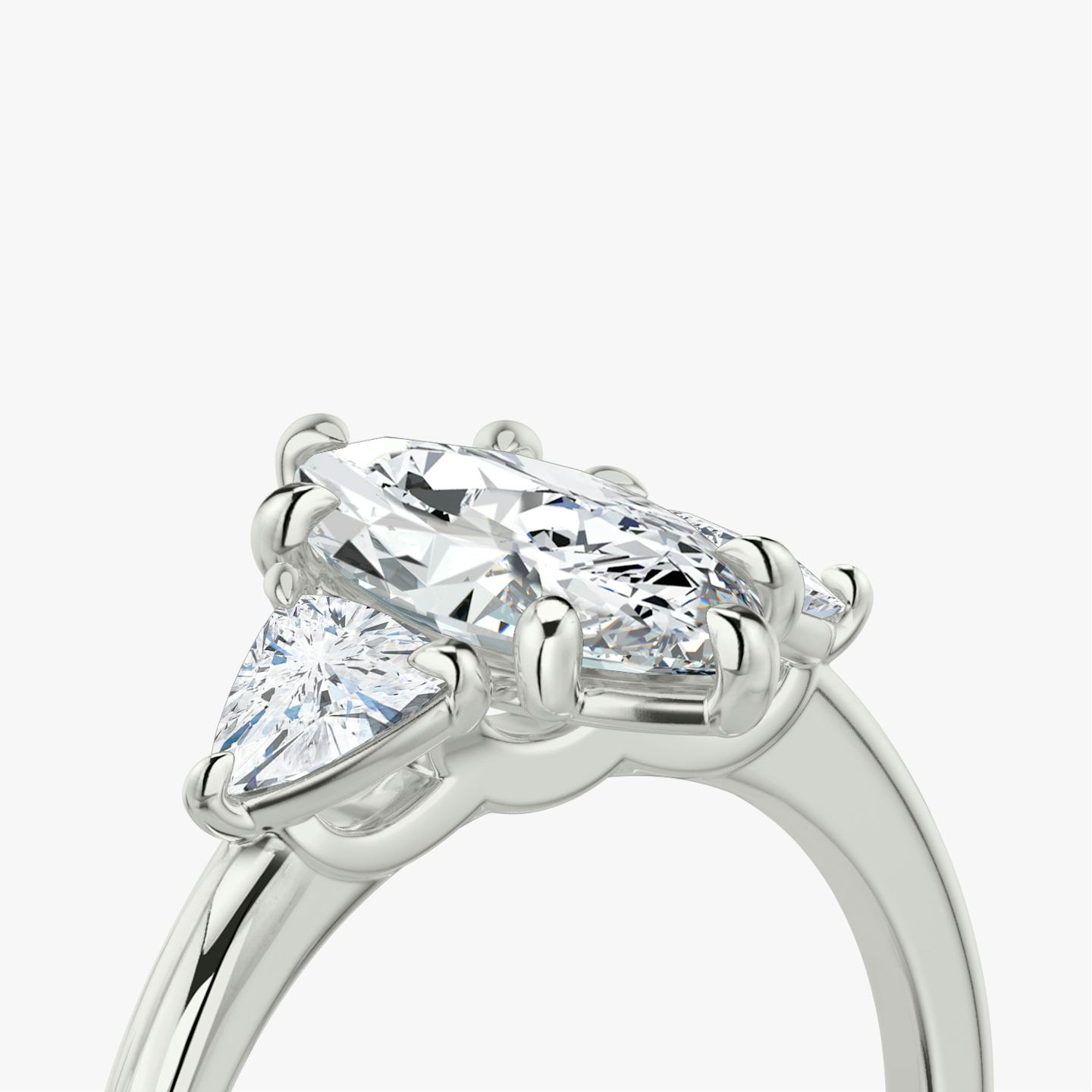 The Three Stone | Pavé Marquise | Platinum | Band: Plain | Side stone carat: 1/4 | Side stone shape: Trillion | Diamond orientation: vertical | Carat weight: See full inventory