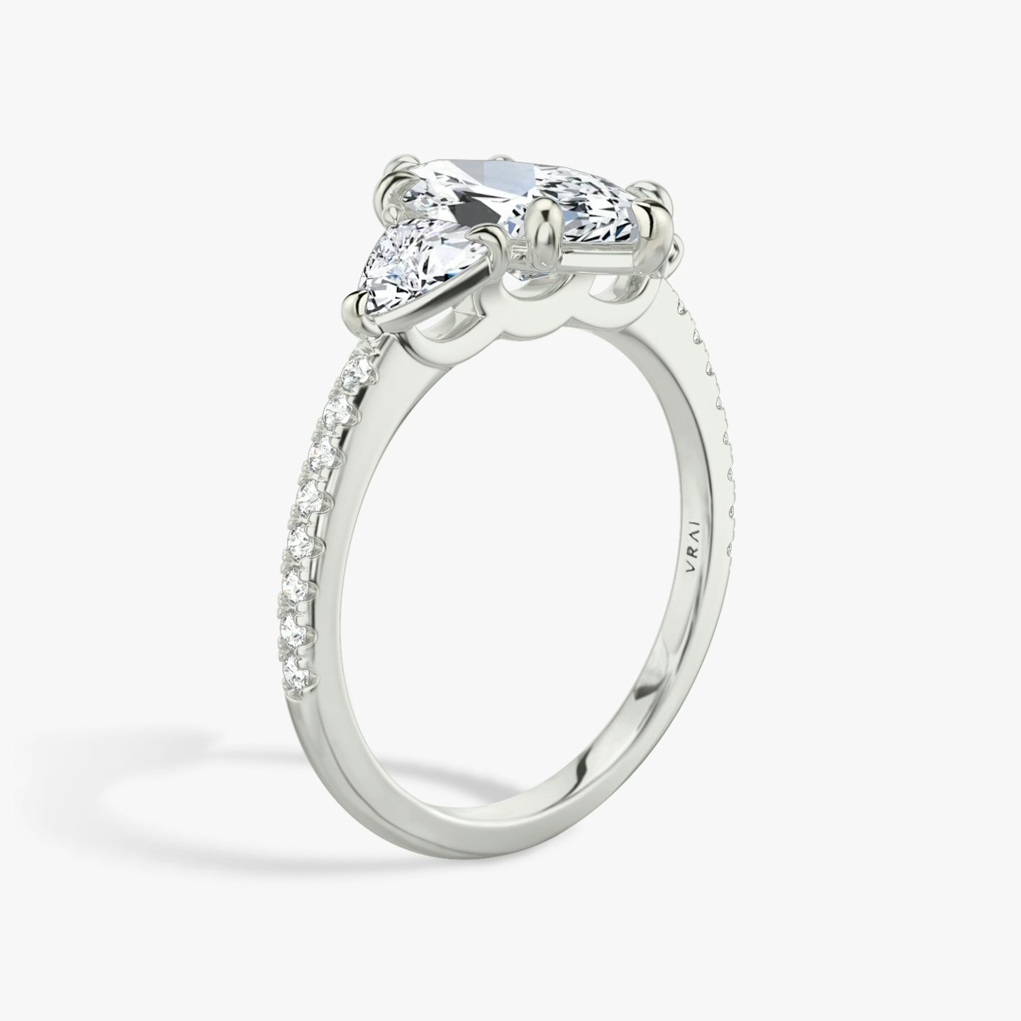 The Three Stone | Pavé Marquise | Platinum | Band: Pavé | Side stone carat: 1/4 | Side stone shape: Trillion | Diamond orientation: vertical | Carat weight: See full inventory