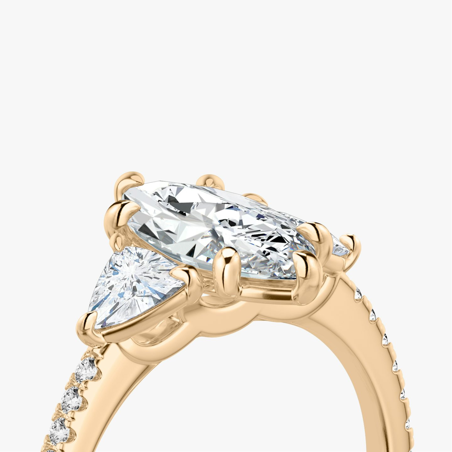 The Three Stone | Pavé Marquise | 14k | 14k Rose Gold | Band: Pavé | Side stone carat: 1/4 | Side stone shape: Trillion | Diamond orientation: vertical | Carat weight: See full inventory