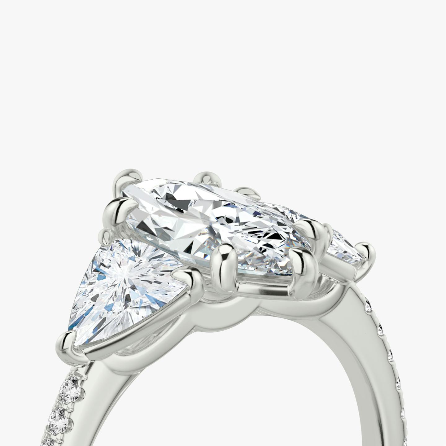 The Three Stone | Pavé Marquise | Platinum | Band: Pavé | Side stone carat: 1/2 | Side stone shape: Trillion | Diamond orientation: vertical | Carat weight: See full inventory