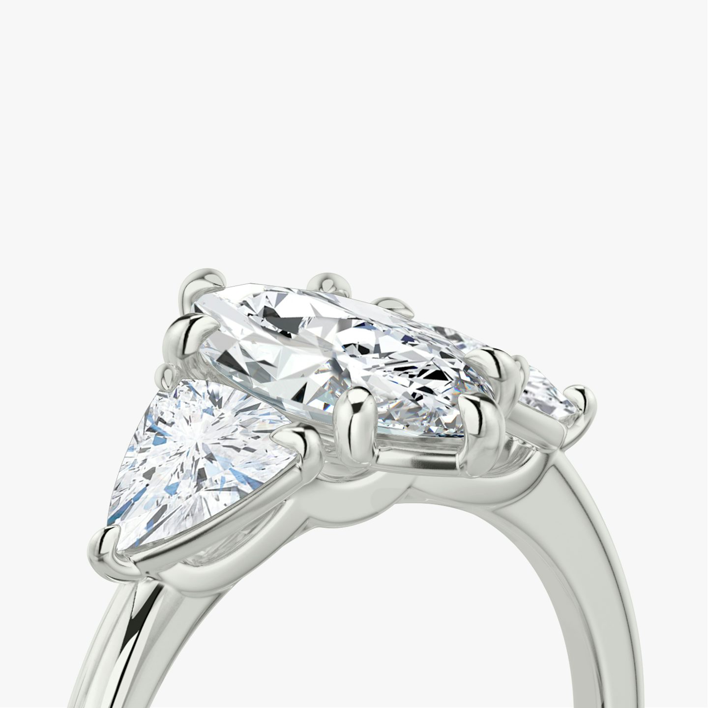 The Three Stone | Pavé Marquise | Platinum | Band: Plain | Side stone carat: 1/2 | Side stone shape: Trillion | Diamond orientation: vertical | Carat weight: See full inventory