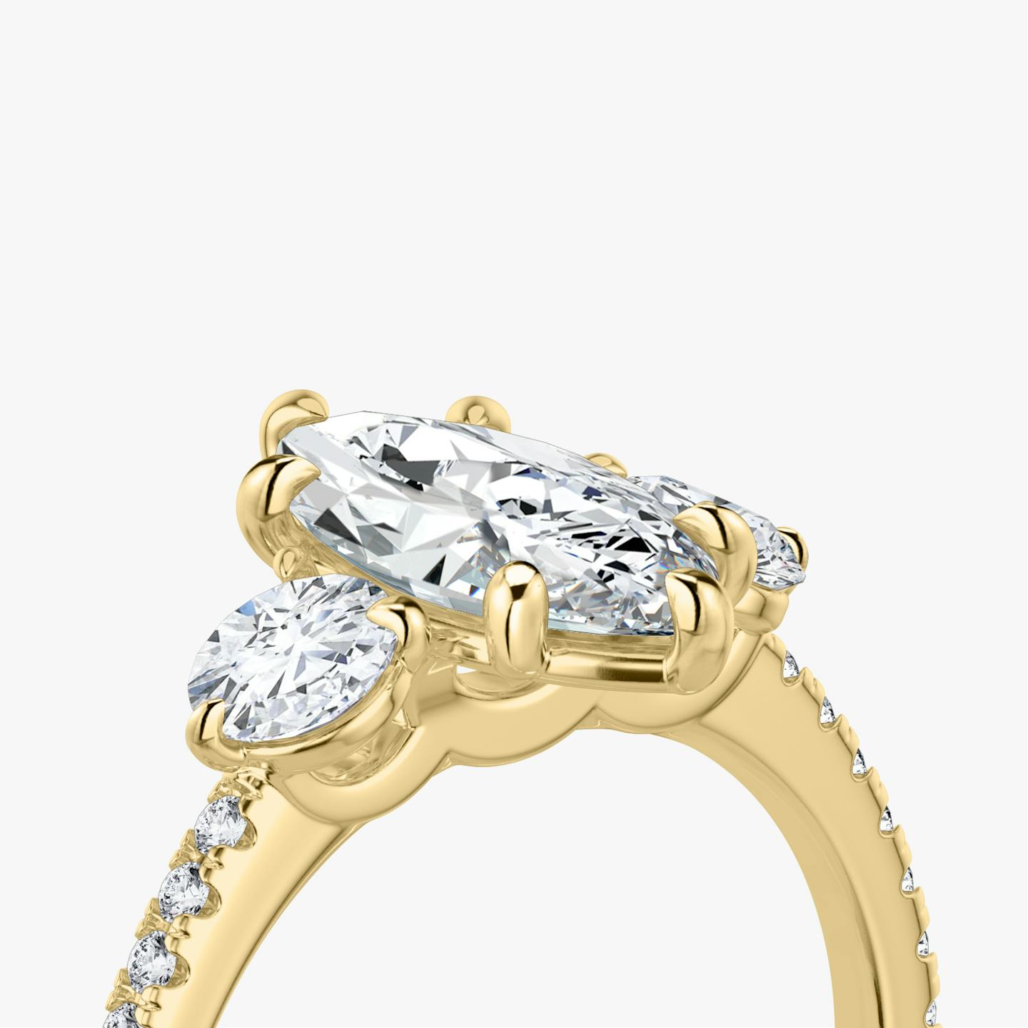 The Three Stone | Pavé Marquise | 18k | 18k Yellow Gold | Band: Pavé | Side stone carat: 1/4 | Side stone shape: Round Brilliant | Diamond orientation: vertical | Carat weight: See full inventory