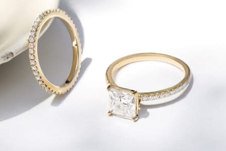 A princess cut engagement ring and matching wedding band