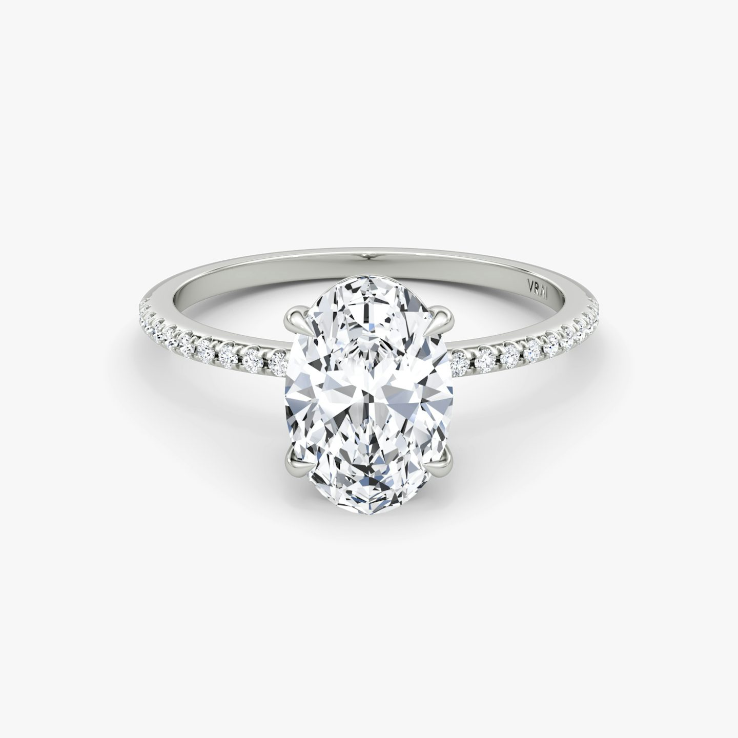 The Petite 4-Prong Solitaire | Oval | Platinum | Band: Pavé | Diamond orientation: vertical | Carat weight: See full inventory
