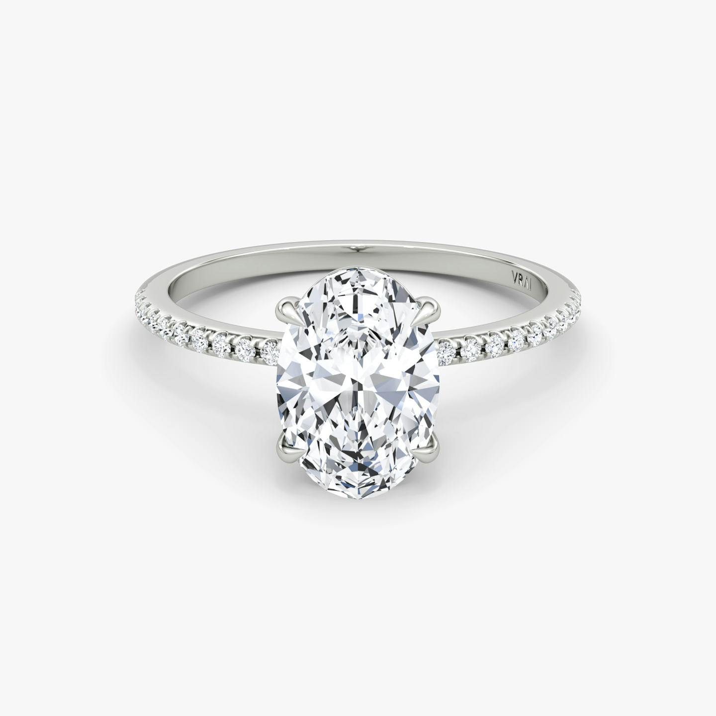 The Petite 4-Prong Solitaire | Oval | 18k | 18k White Gold | Band: Pavé | Diamond orientation: vertical | Carat weight: See full inventory