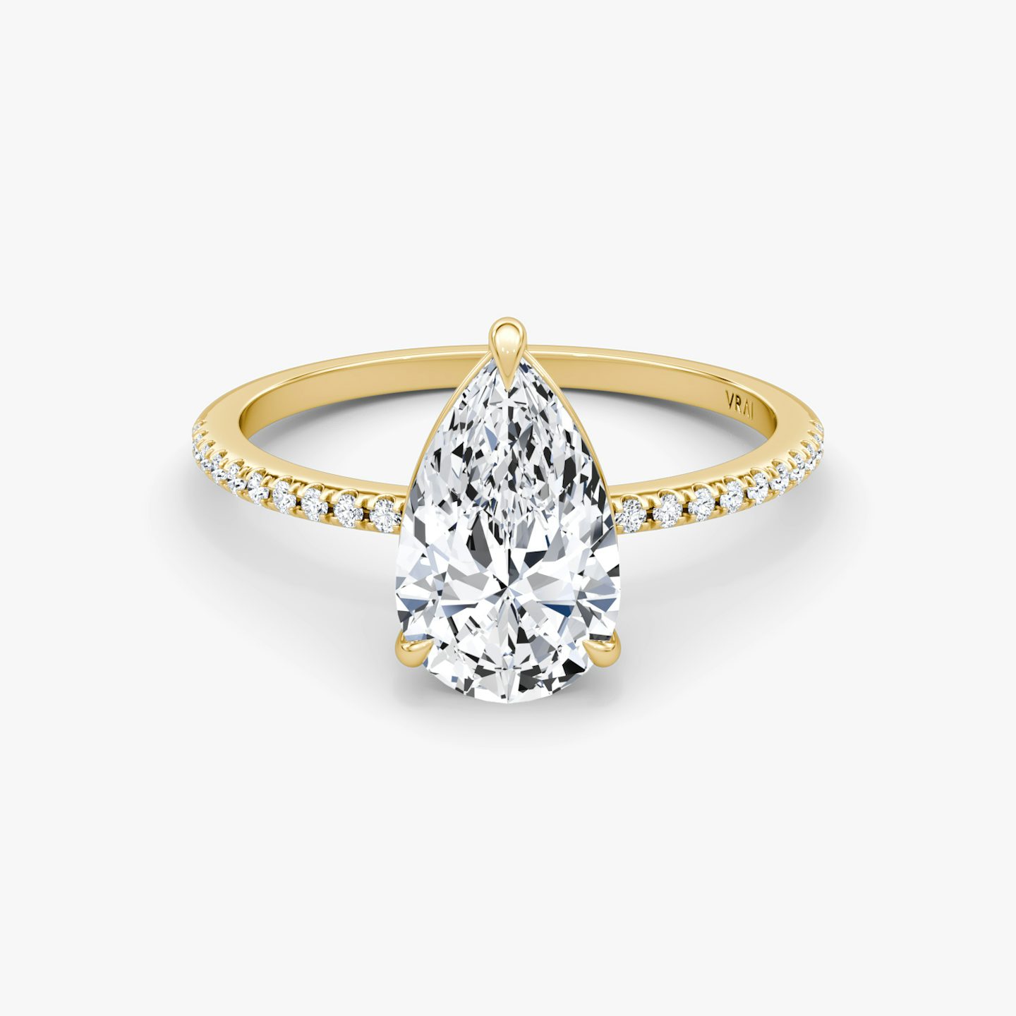 The Petite 4-Prong Solitaire | Pear | 18k | 18k Yellow Gold | Band: Pavé | Diamond orientation: vertical | Carat weight: See full inventory
